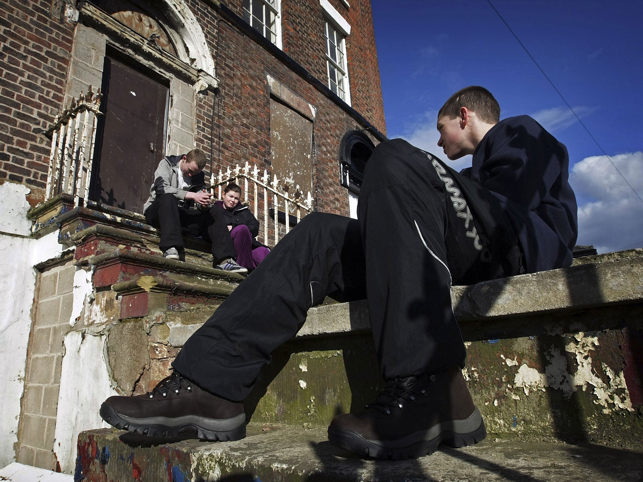 Inner-city youngsters Michael Broadhurst (R), aged 16, Craig Campbell, also 16 and Sian Lovell, 21 from Liverpool's Kirkdale district prepare for their hiking holiday to the English countryside for the first time in their lives on March 4, 2009, Liverpool, United Kingdom.