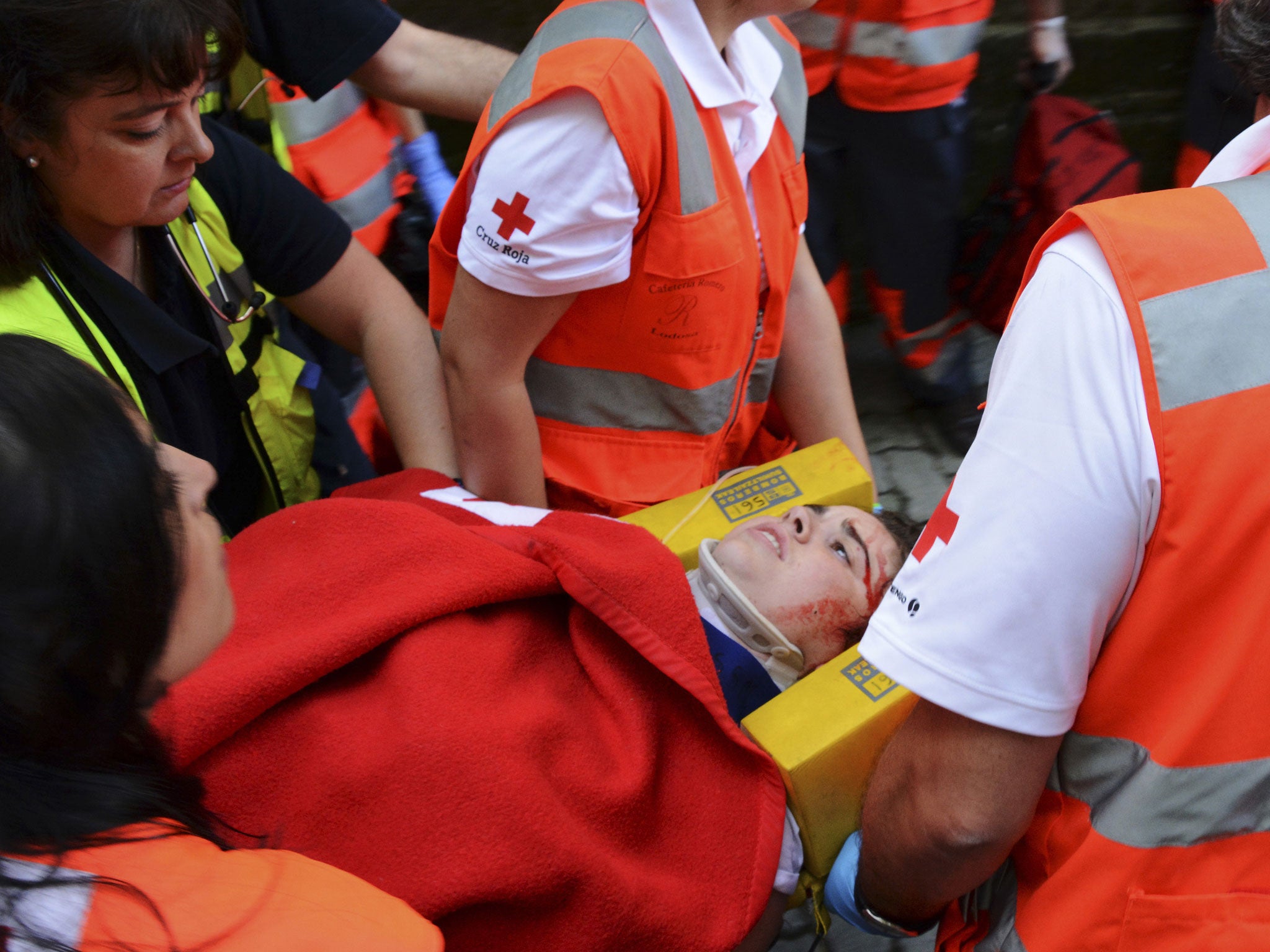 The Australian woman is taken away after being gored