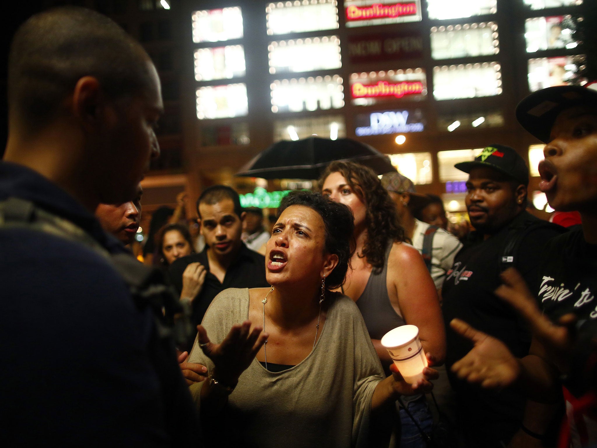 A woman in New York reacts to the decision to clear George Zimmerman of the murder of a black teenager, Trayvon Martin, in Florida. The case has become a cause celebre among anti-racist activists