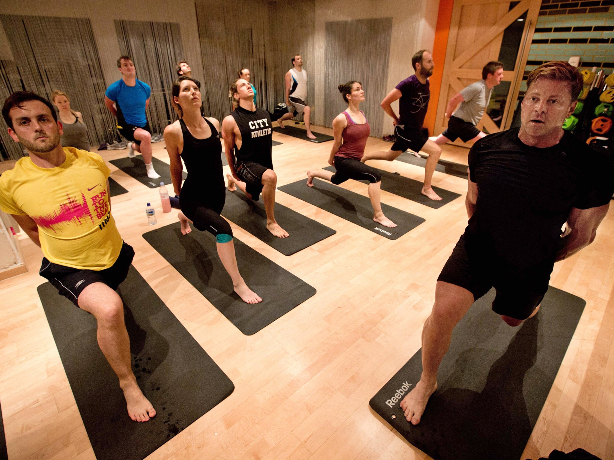 Sweat shop: Simon Usborne joins a Broga UK class in London with instructor Matt Miller