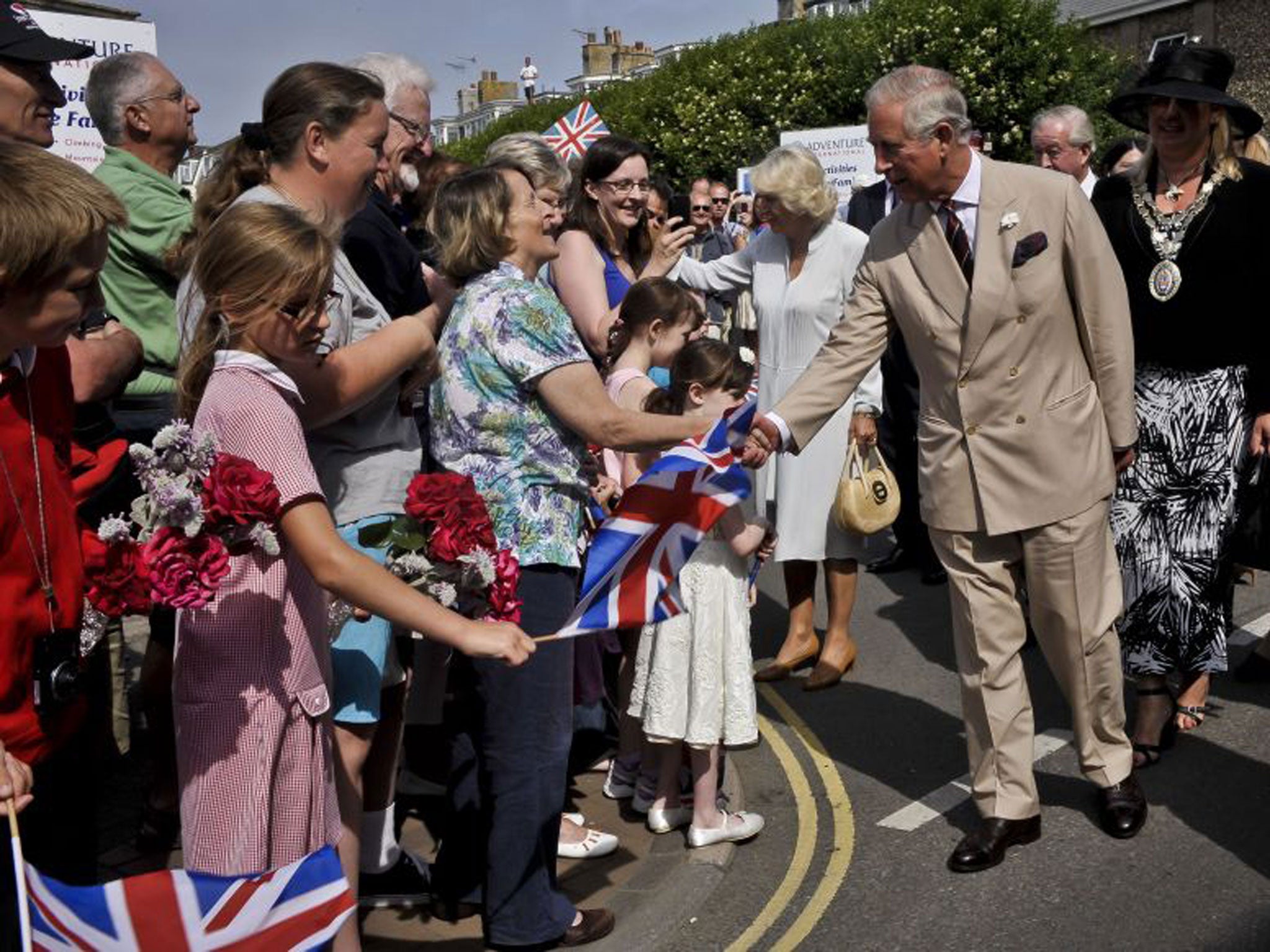 The Prince of Wales greets wellwishers in the Cornish resort of Bude yesterday as he and the Duchess of Cornwall start their annual three-day tour of Devon and Cornwall