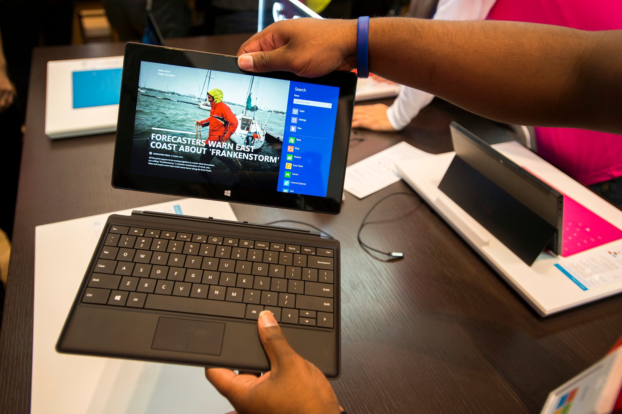 Sales staff demonstrate the Microsoft Surface during the opening of Microsoft's retail store in New York's Times Square October 25, 2012. REUTERS/Keith Bedford