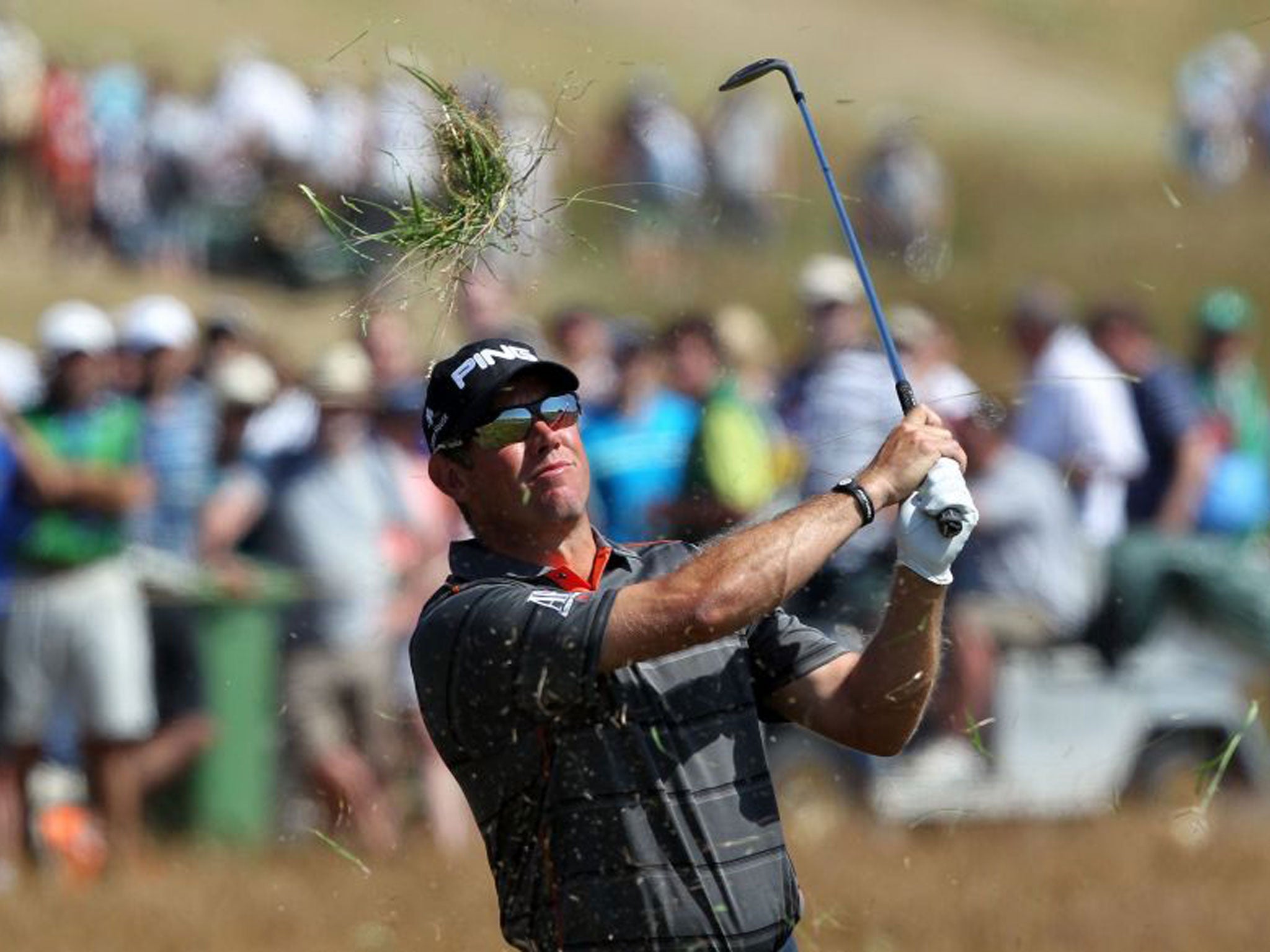 Lee Westwood launches his approach to the 14th green yesterday