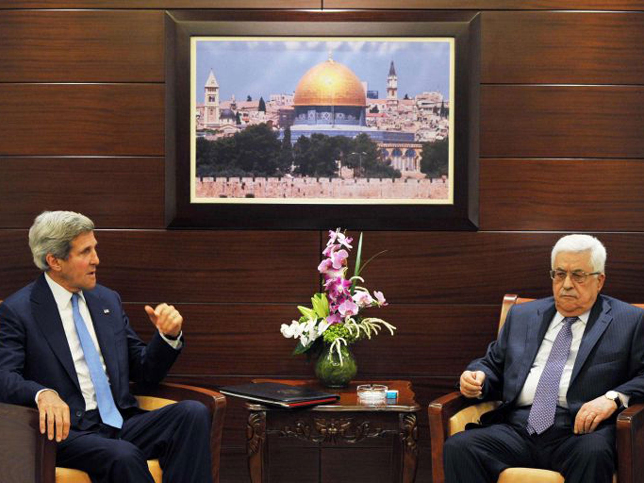U.S. Secretary of State John Kerry (L) meets with Palestinian President Mahmoud Abbas at the Mukataa compound, in the West Bank city of Ramallah