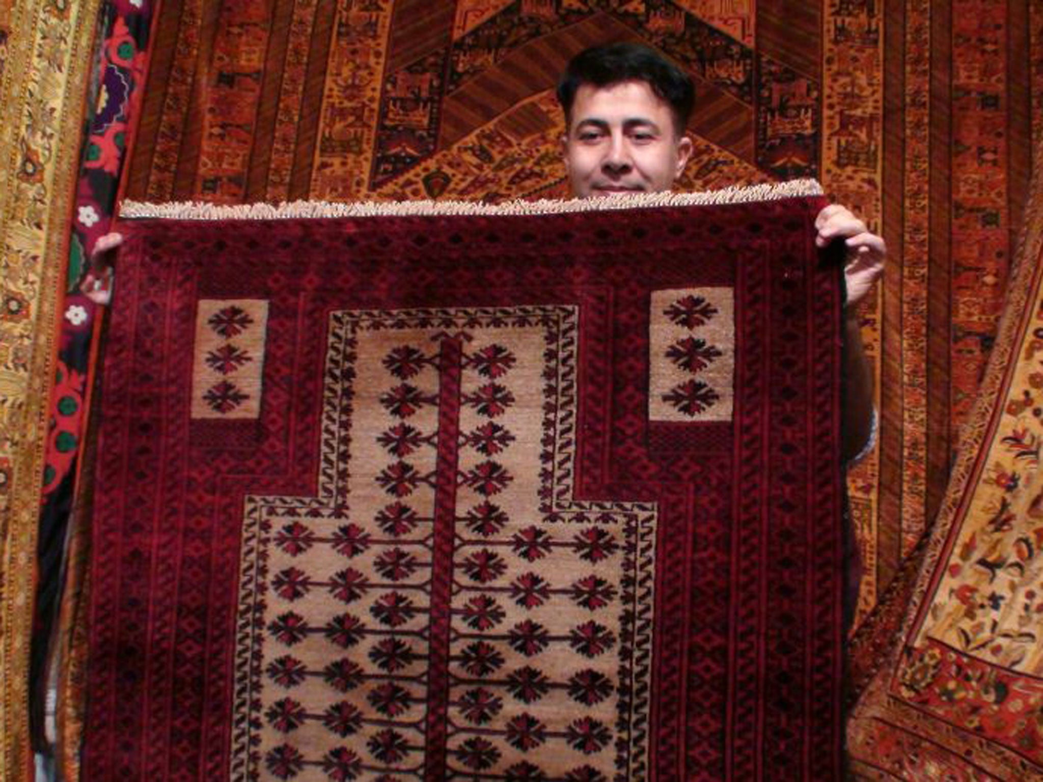 Millions of hand-woven rugs are turned out in Tehran but machine-made alternatives are beginning to outsell them