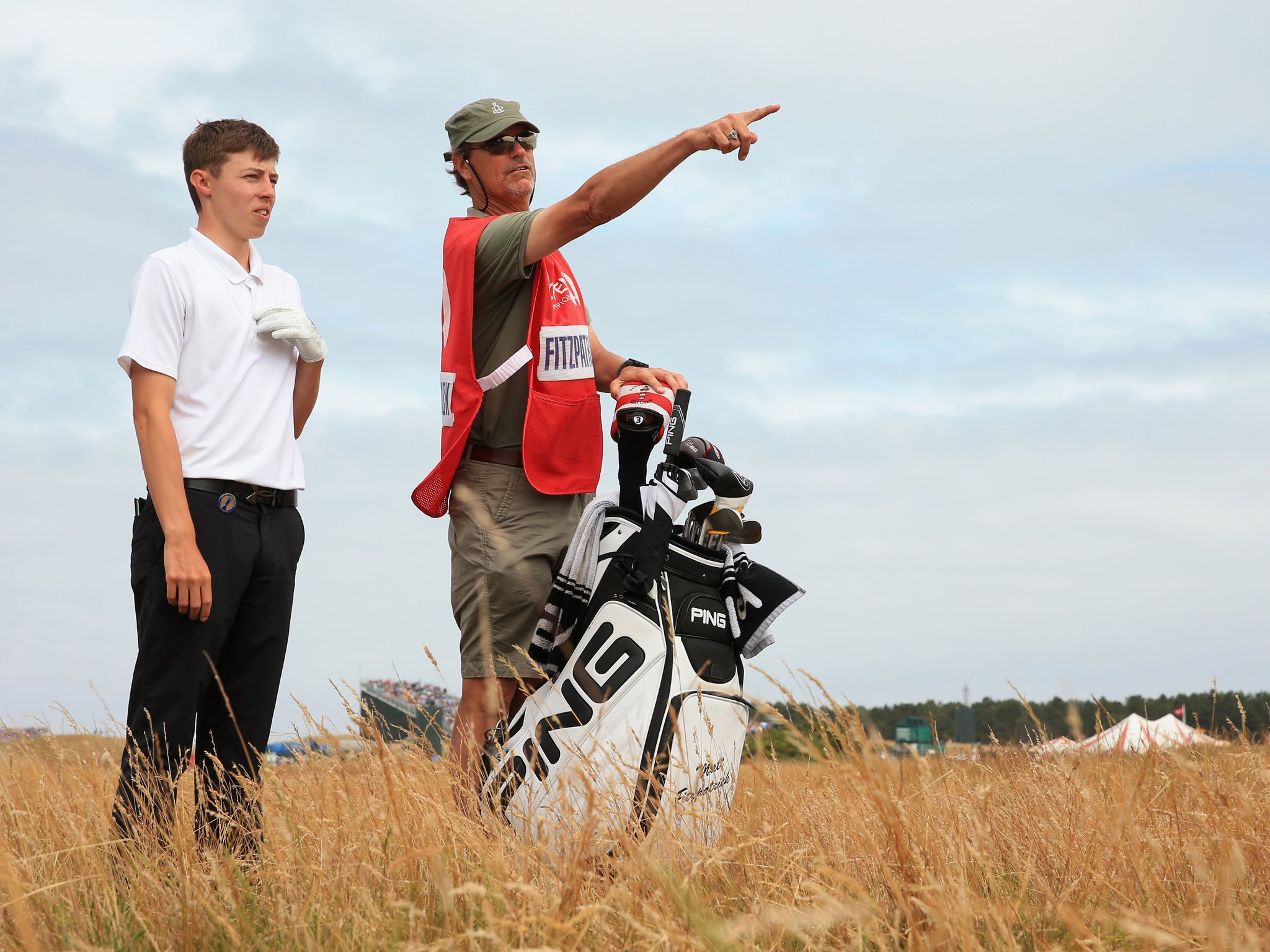 18-year-old Matthew Fitzpatrick consults his caddie Lorne Duncan on his way to the Silver Medal