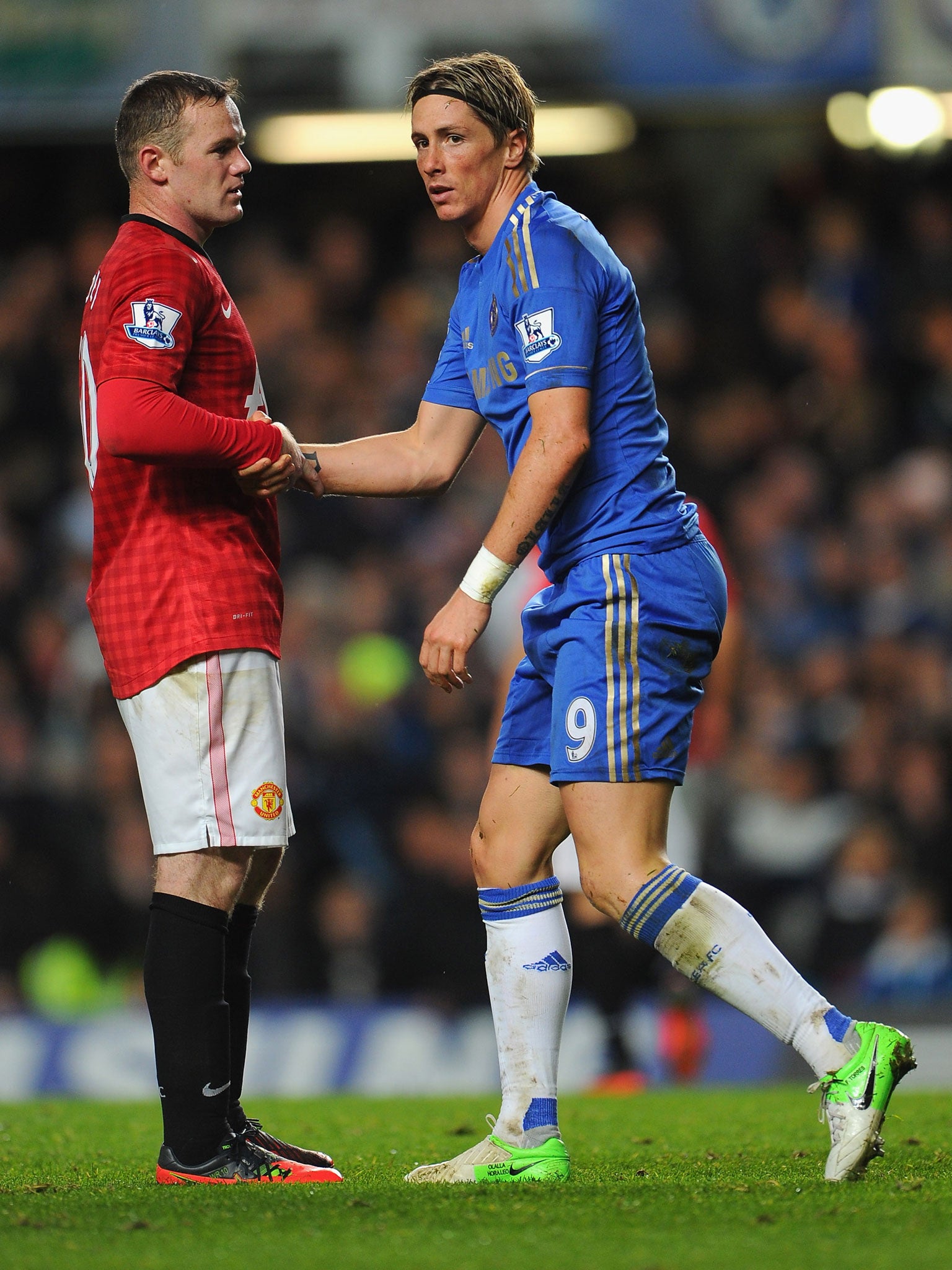 Wayne Rooney, left, and Fernando Torres, right, could soon be rivals to lead the Chelsea attack if Jose Mourinho gets his man