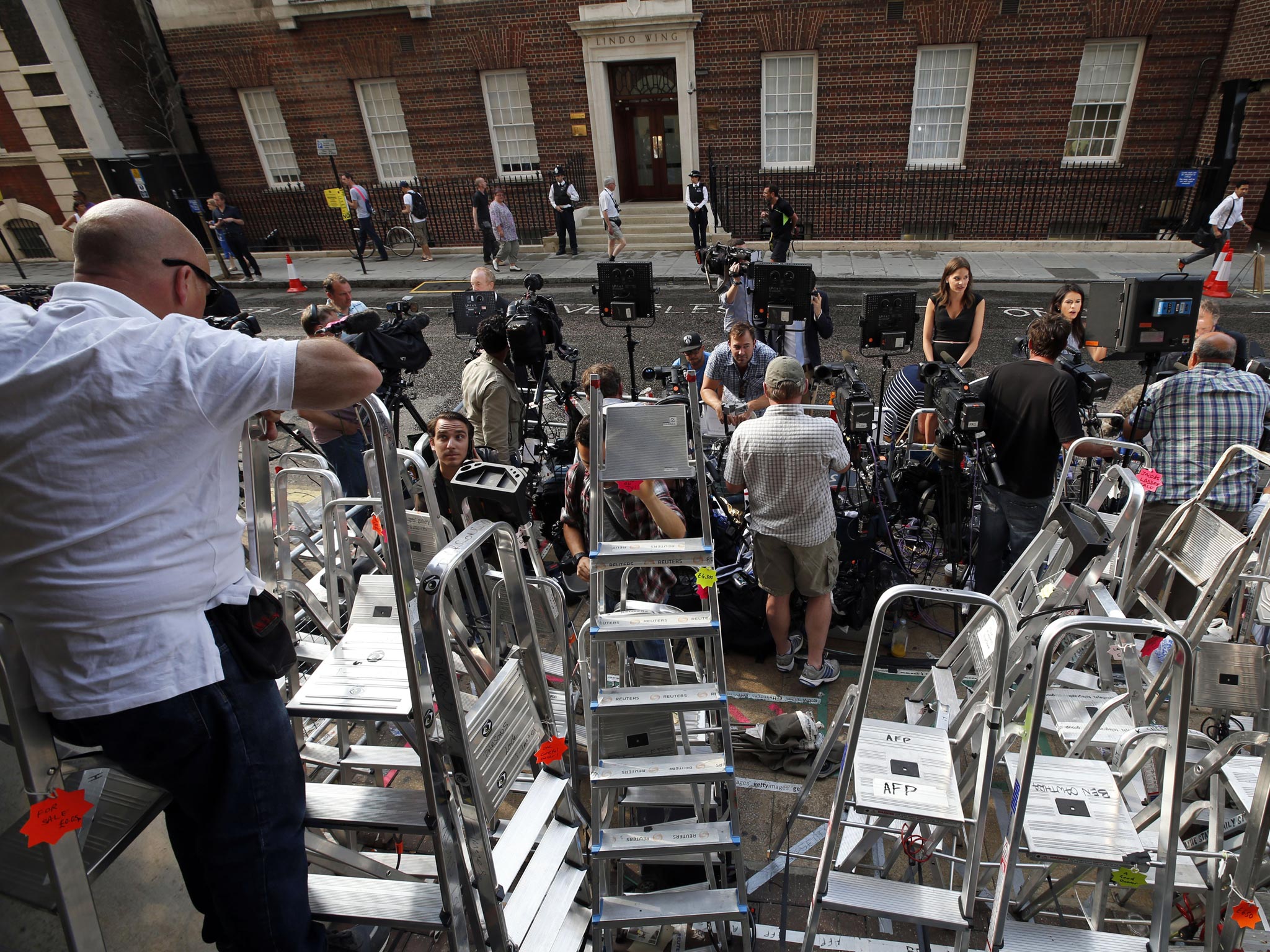 The scrum of photographers outside the hospital this morning