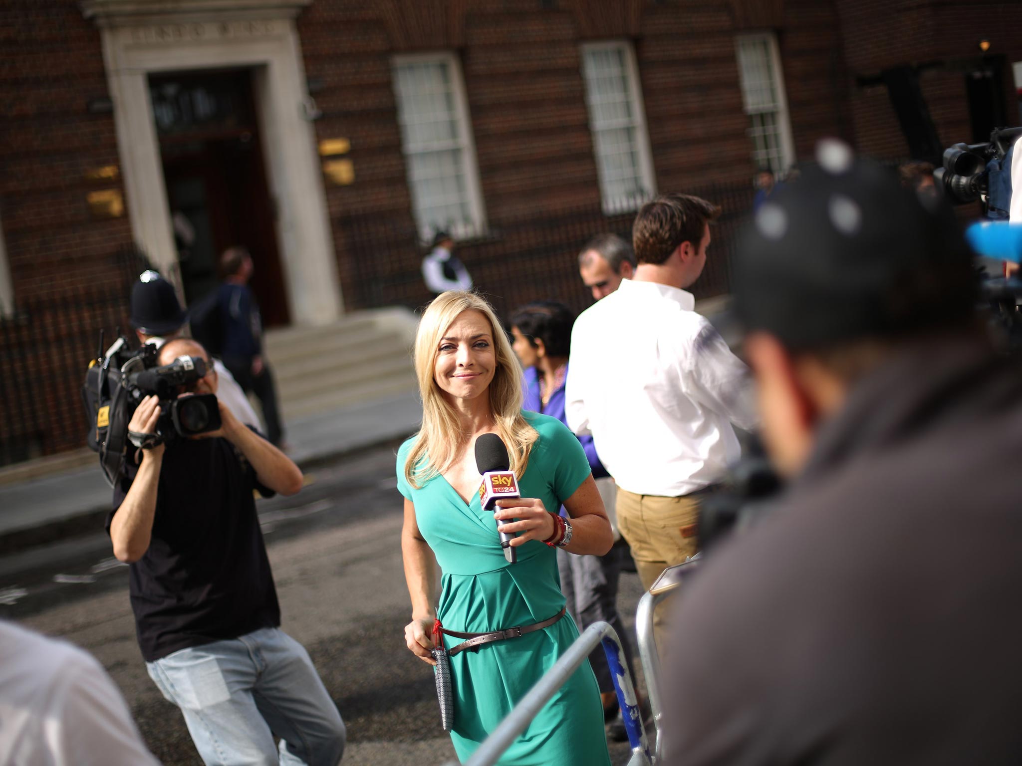 An Italian TV journalist reports from outside St Mary's Hospital in London, England