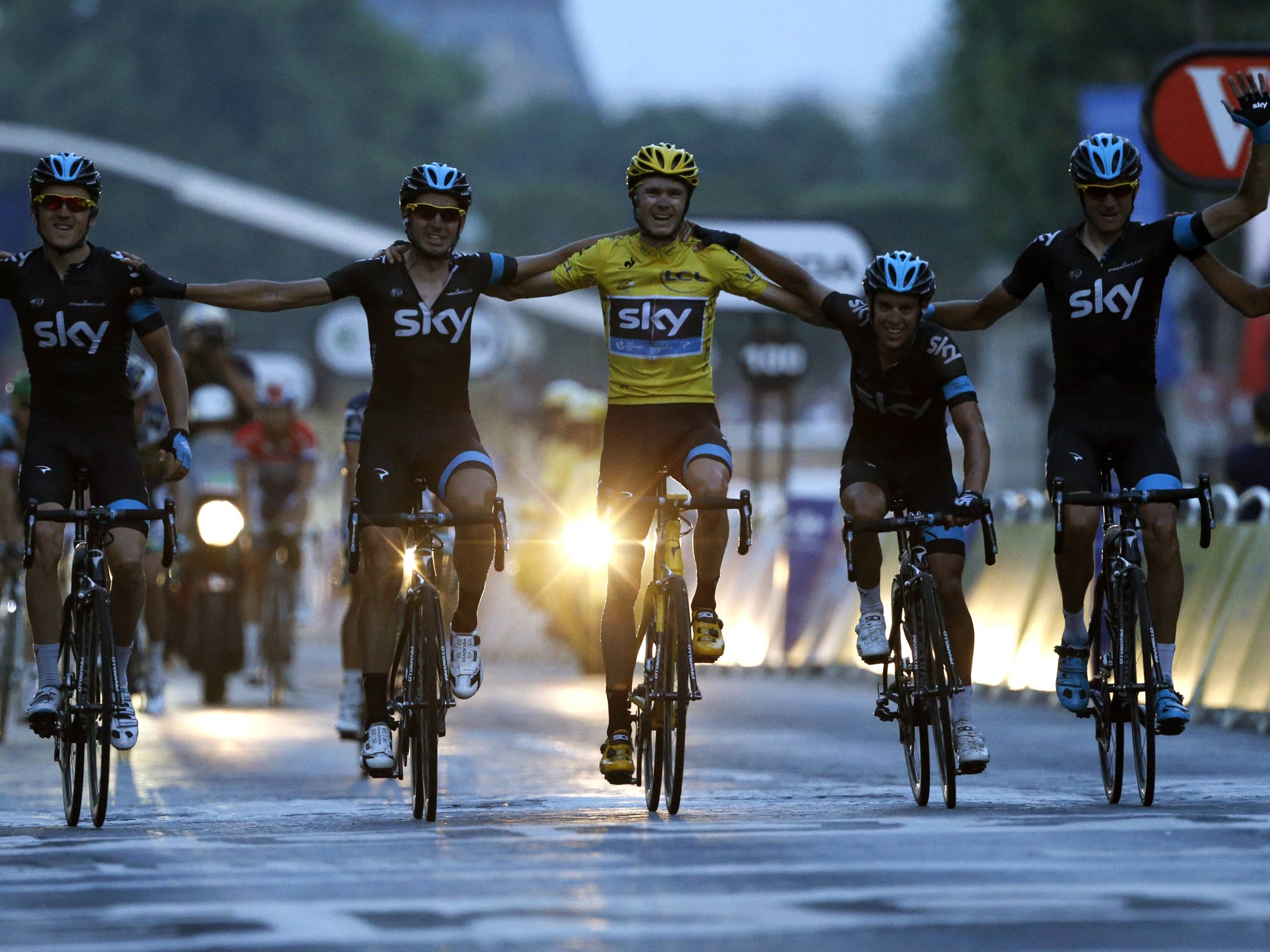 Chris Froome crosses the line with his 2013 Team Sky team-mates