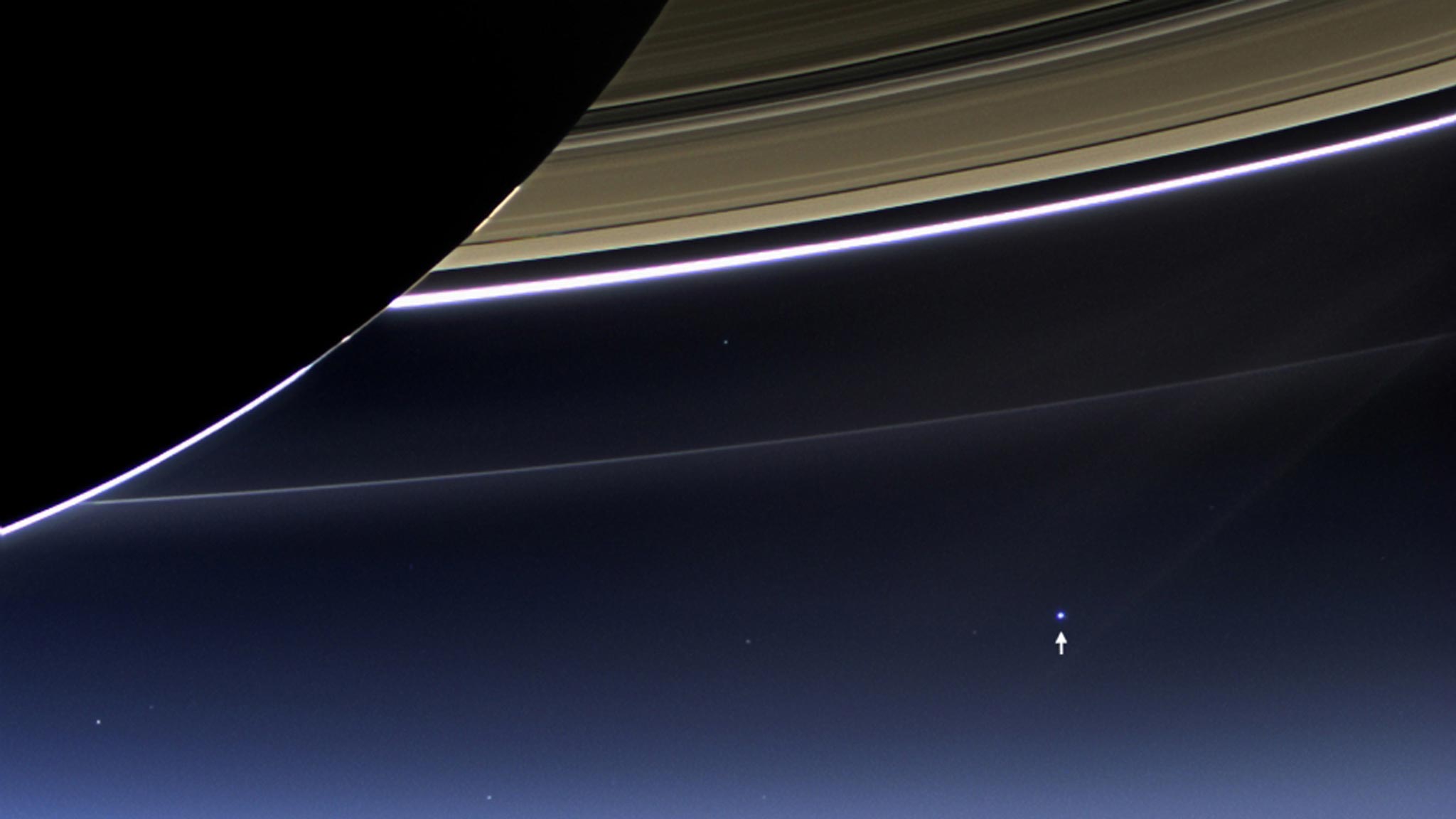 A camera on Nasa's Cassini spacecraft captures Saturn's rings and our planet Earth and its moon