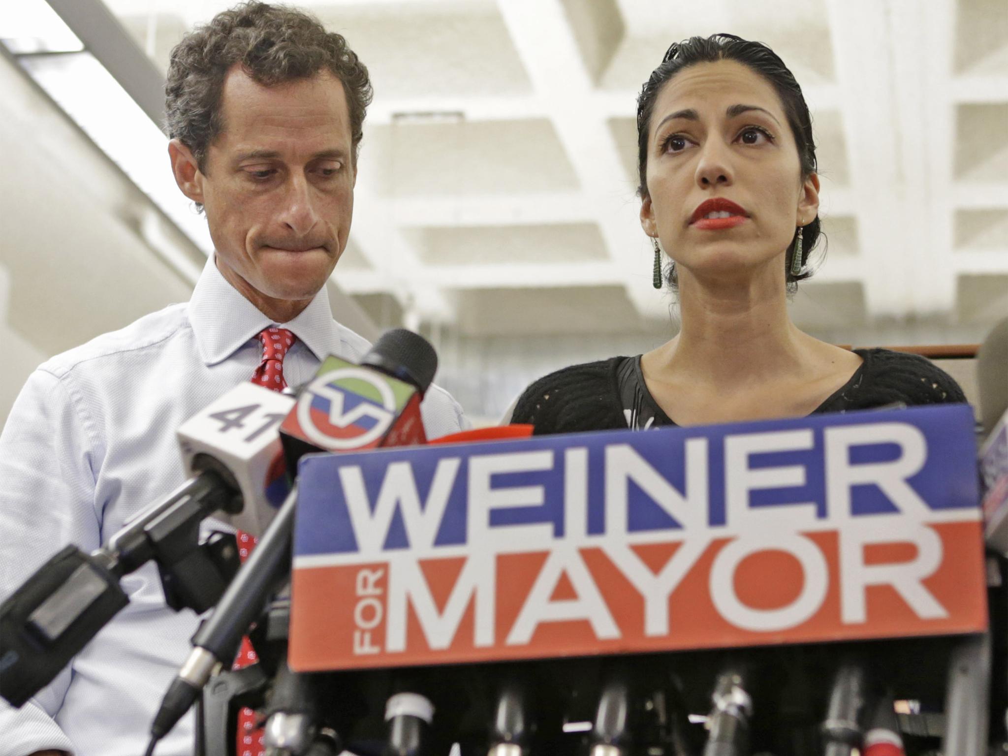 Anthony Weiner and his wife Huma Abedin at a press conference on Tuesday