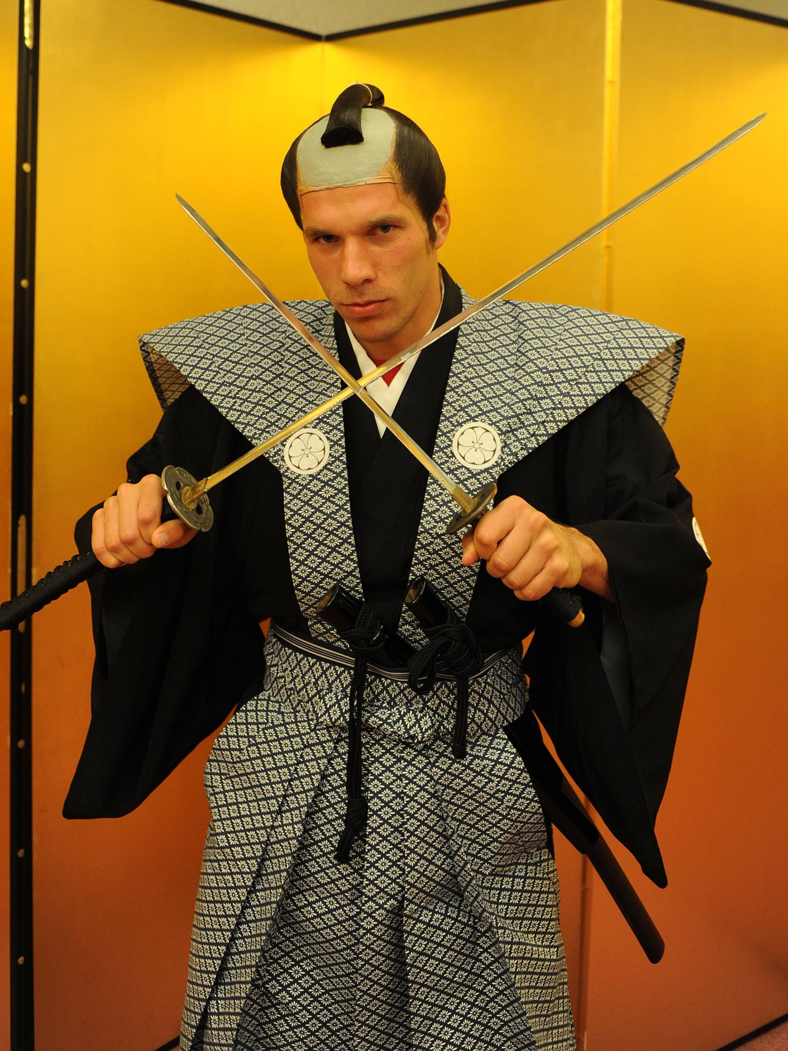 Lukas Podolski of Arsenal FC is dressed as Samurai Warrior in the Urawa Royal Pines Hotel in Japan