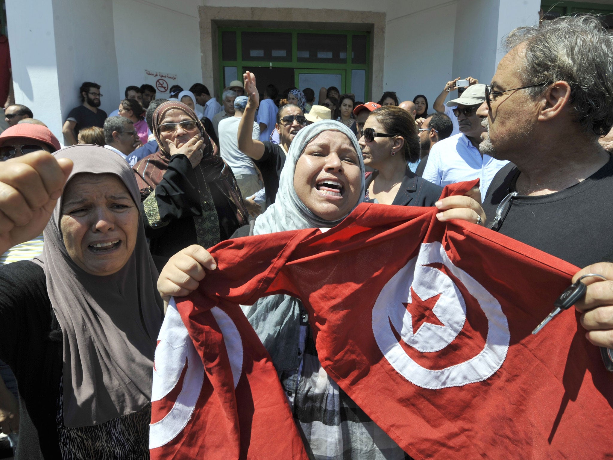 Protesters mourn the death of Mohamed Brahmi