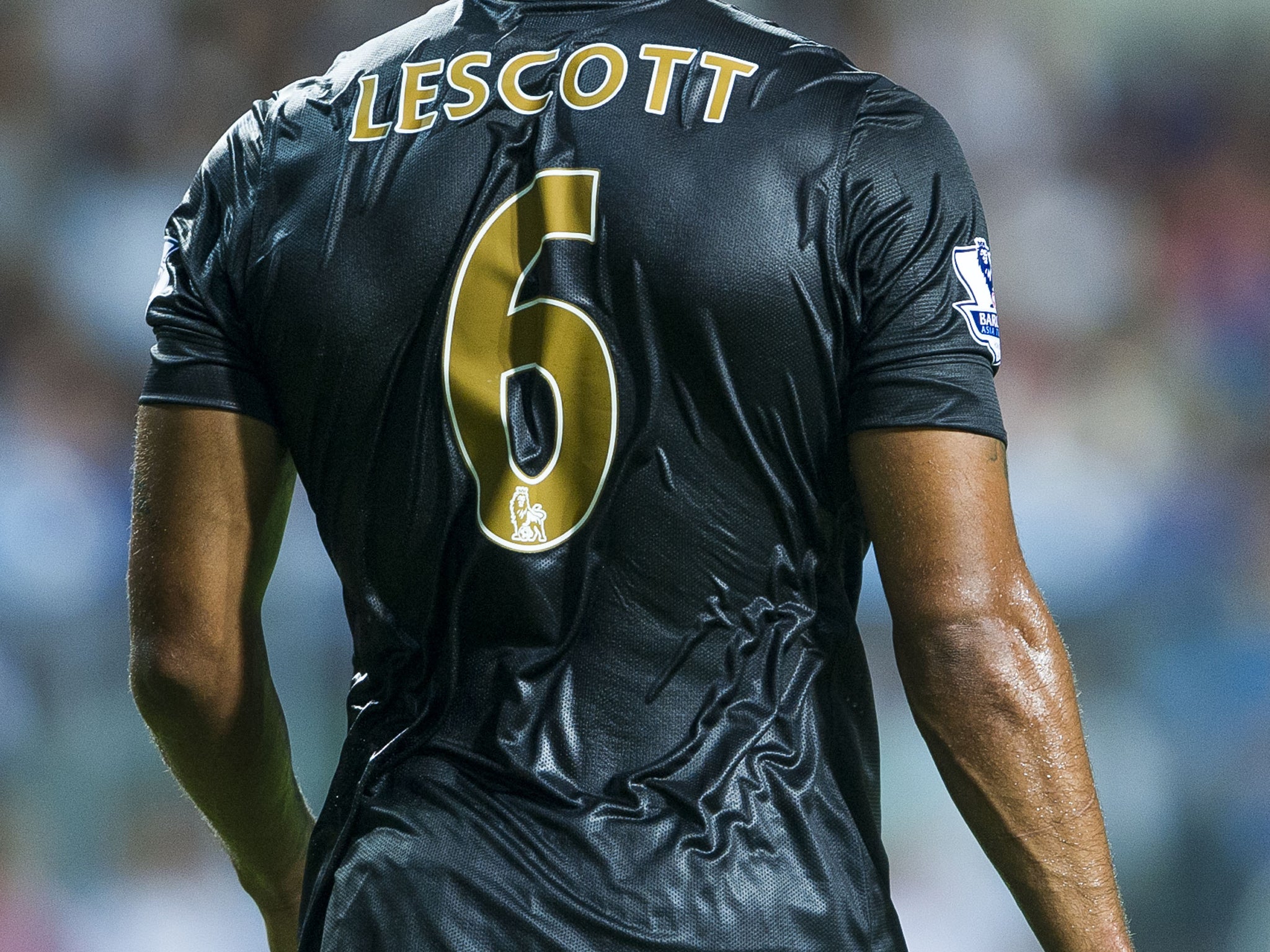 Joleon Lescott is soaked during Manchester City's match with South China in Hong Kong