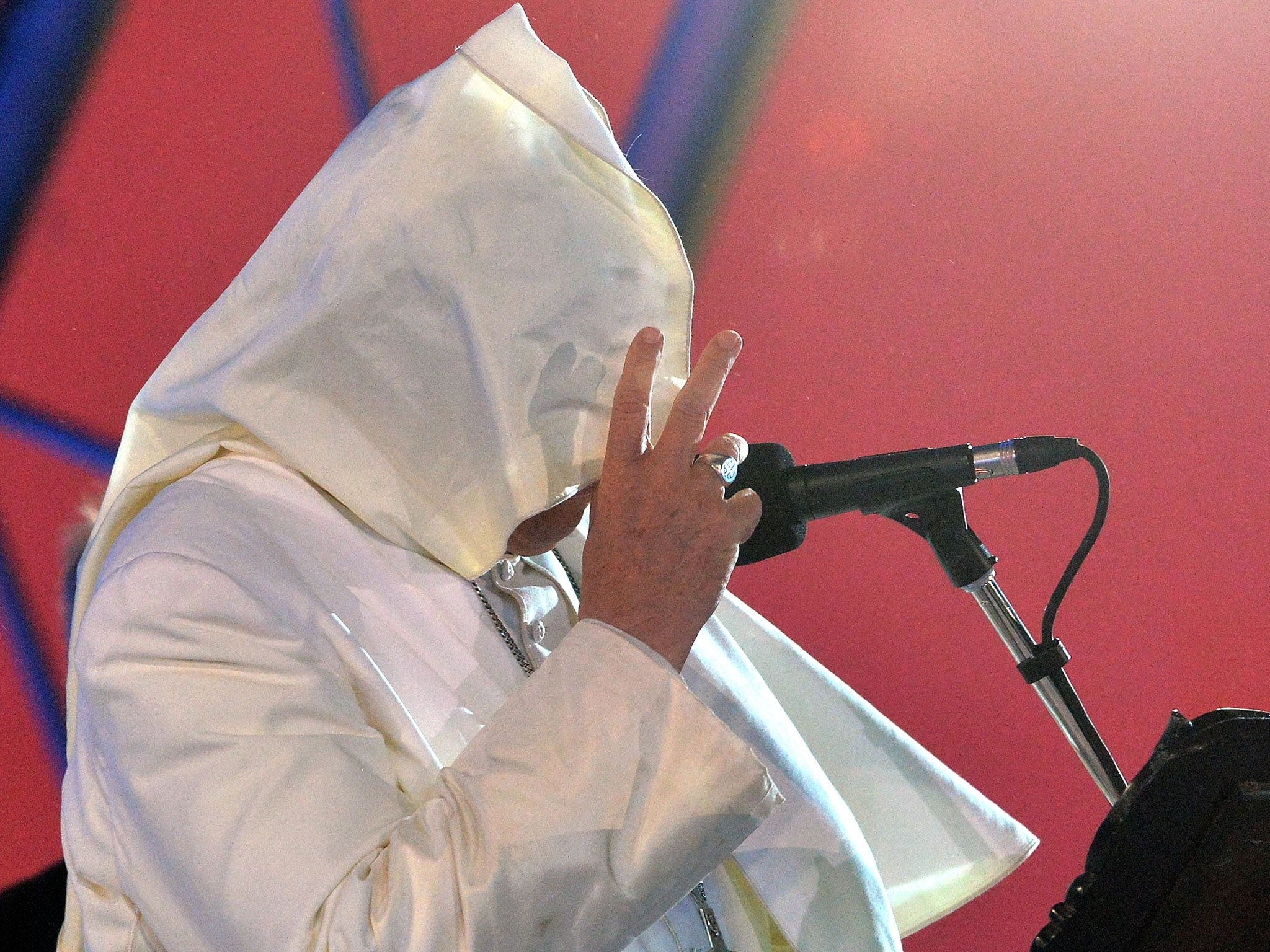 The wind blows Pope Francis's mantle as he speaks at Copacabana beach in Rio de Janeiro