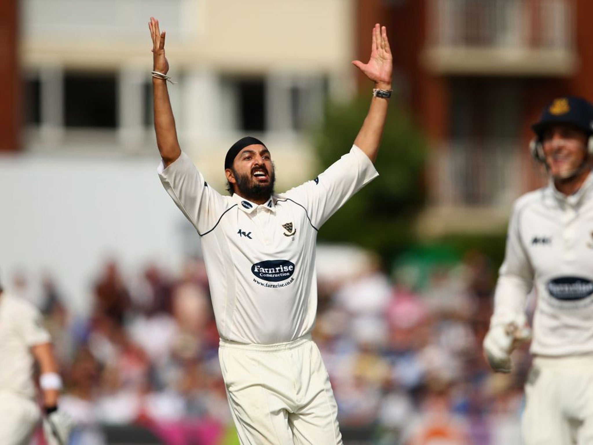 Monty Panesar of Sussex celebrates after taking the wicket of James Faulkner of Australia during Day One of the Tour Match between Sussex and Australia at The County Ground