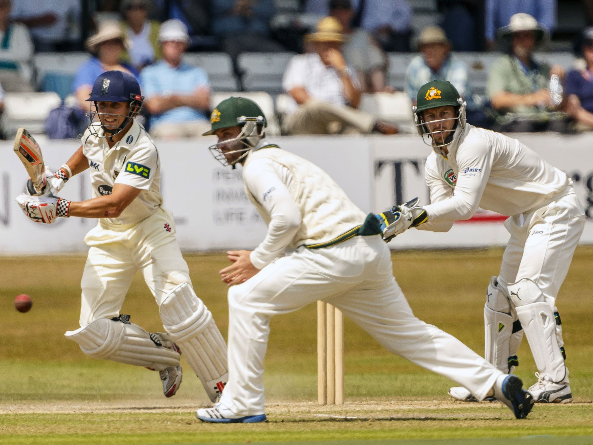 James Taylor, left, goes for a quick single against Australia