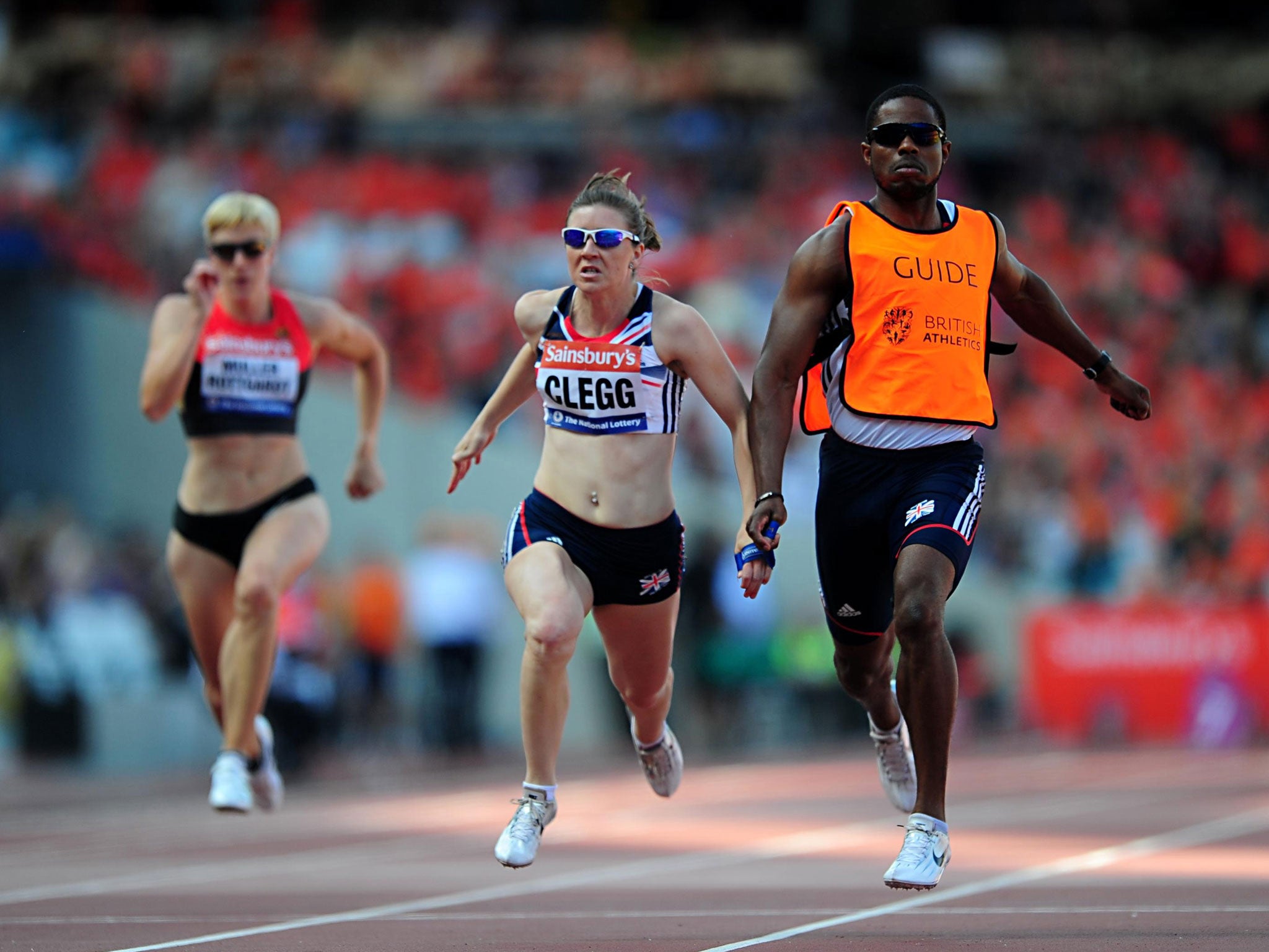 Great Britain's Libby Clegg, centre, during the Women's T12 100 metres during the Sainsburys International Para Challenge at the Olympic Stadium, London