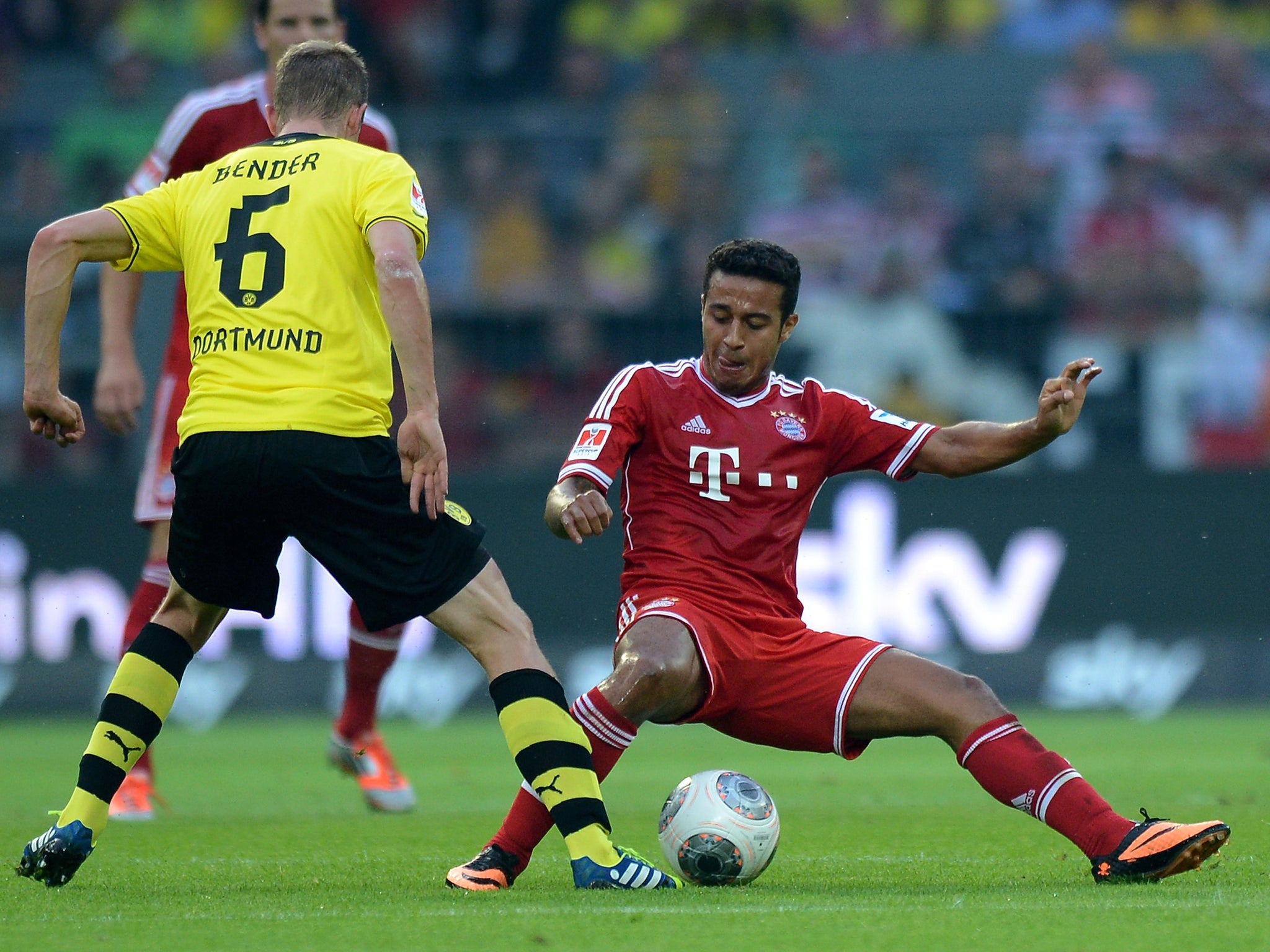 Thiago Alcantara (r) challenges Sven Bender (l) during the 2013 German Super Cup