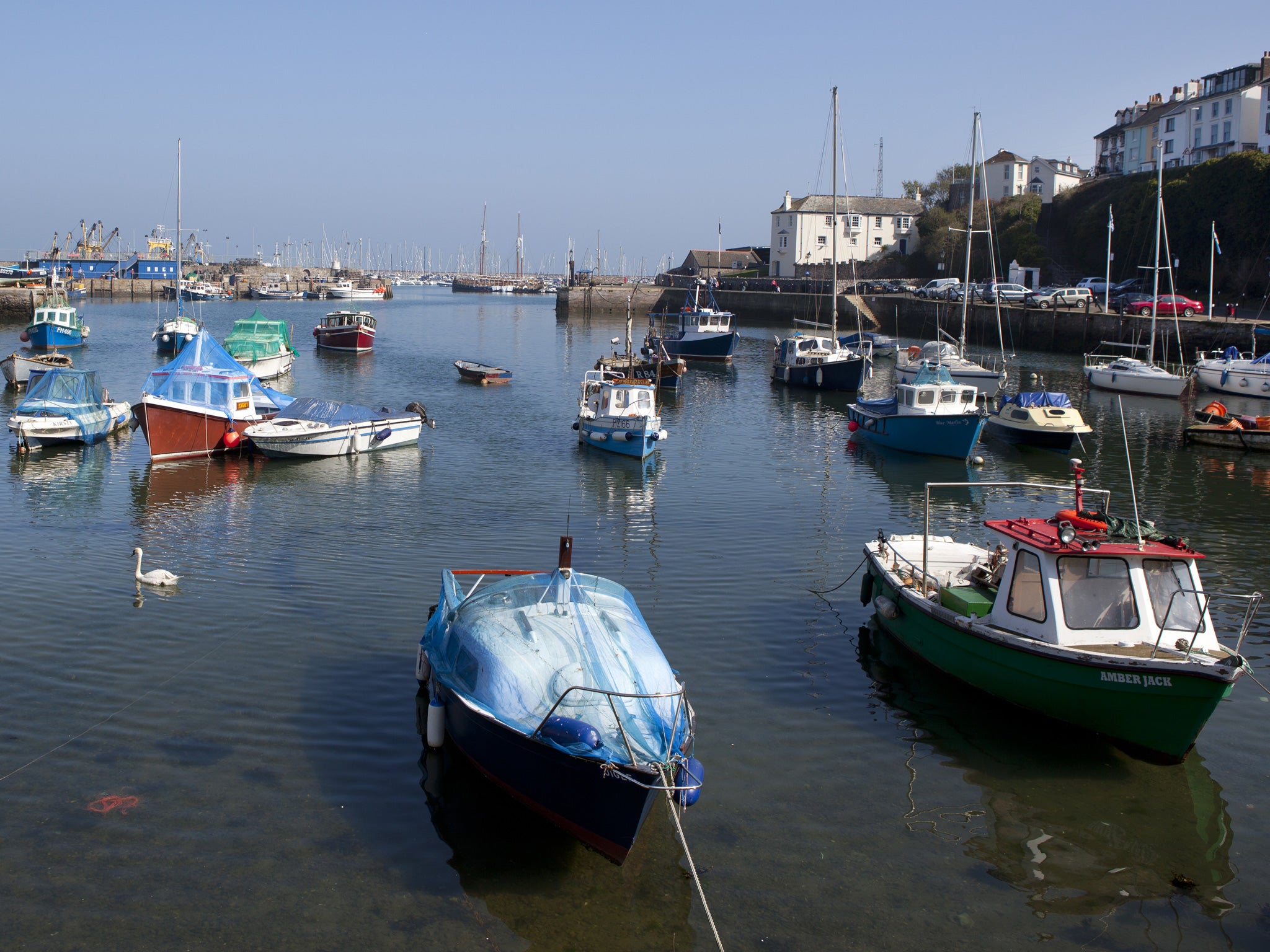 Fishing boats in the harbour of seaside town, Brixham (The Image Bank/Getty)