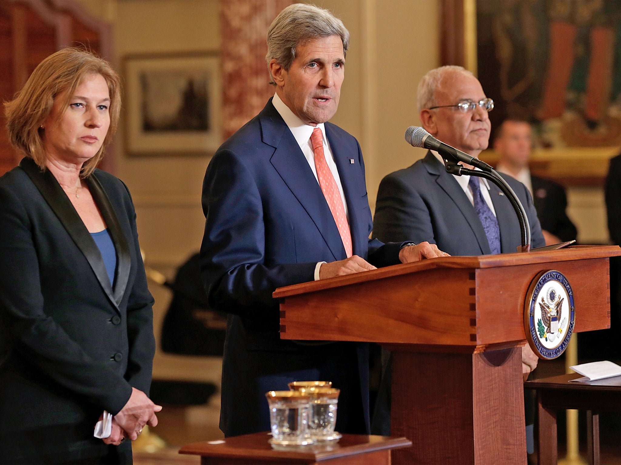 US Secretary of State John Kerry makes a statement with Israeli Justice Minister Tzipi Livni (left) and Palestinian chief negotiator Saeb Erekat during a press conference on the Middle East Peace Process Talks, in Washington