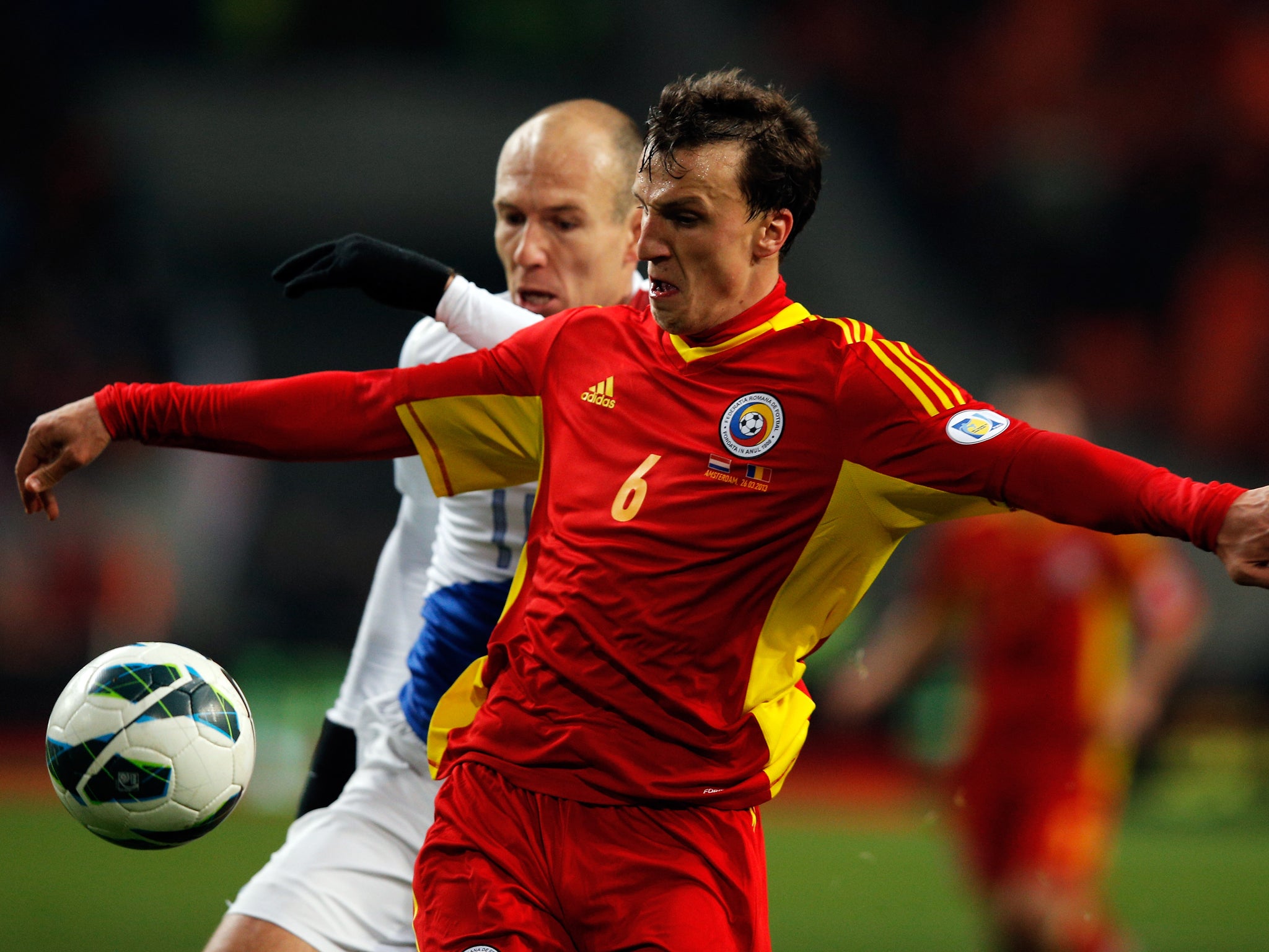 Vlad Chiriches, in action for Steaua Bucharest agains Arjen Robben of Bayern Munich, has been linked with a move to Tottenham