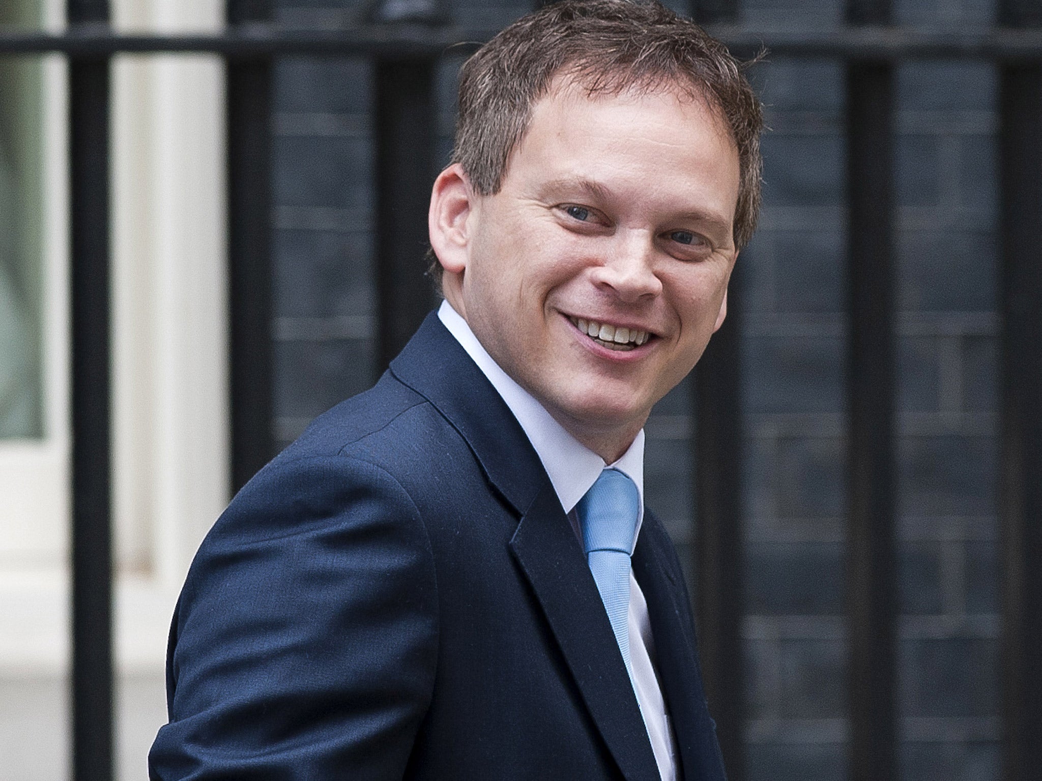 The Tory chairman Grant Shapps has issued a warning to the BBC that it could face licence fee 'cuts' if it doesn't change its ways