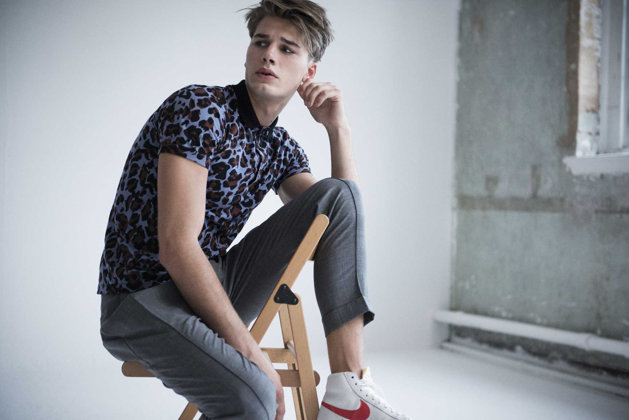 Trousers, £160, by Paul Smith, paulsmith.co.uk; polo shirt, £69, by Raf Simons for Fred Perry, the corner.com; high tops, £70, by Nike, nike.com