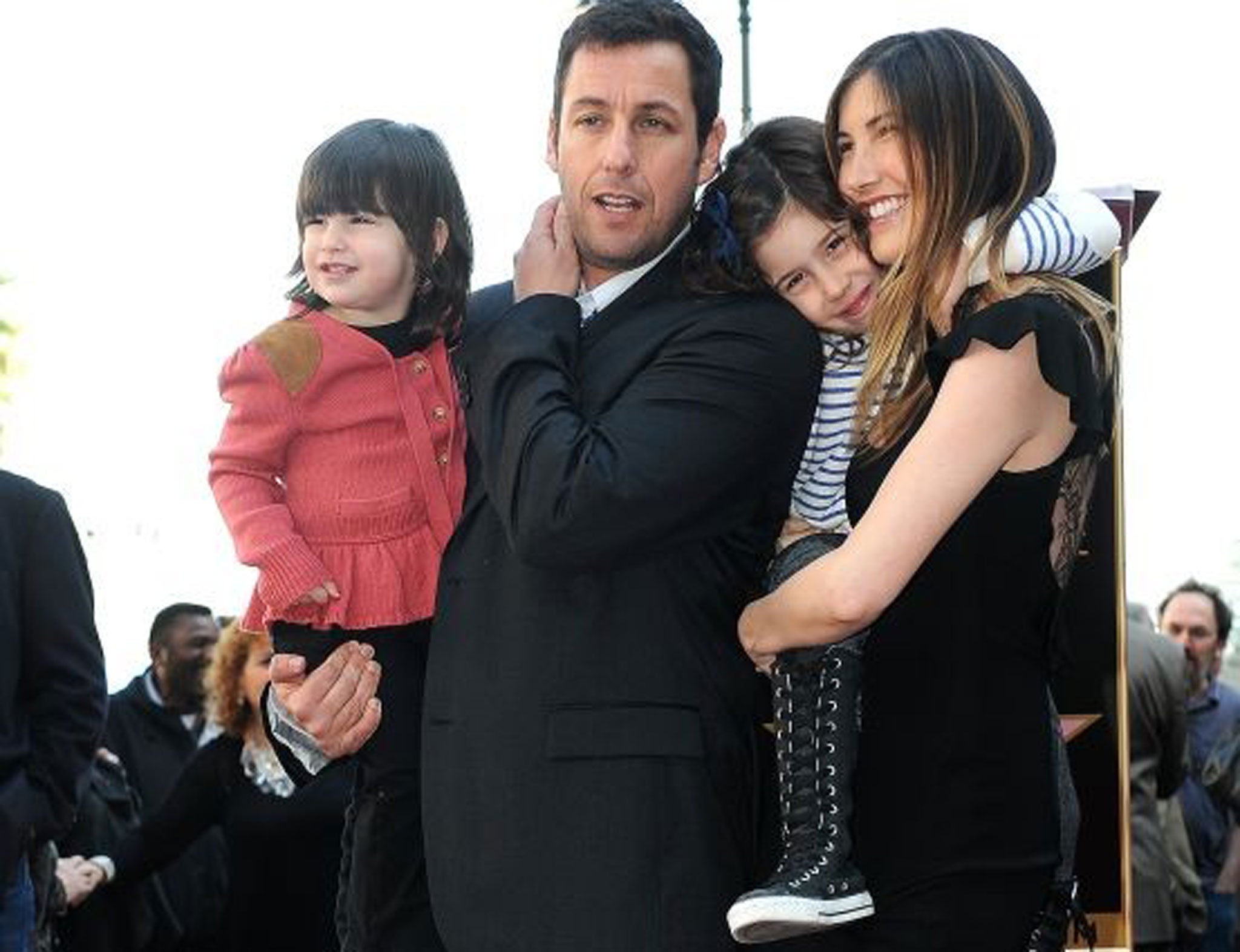 Actor Adam Sandler with his wife Jackie and his daughters Sunny Madeline (left) and Sadie Madison
