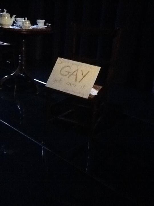 A message on the St James' theatre Facebook read: "During last night's performance of The American Plan an audience member tutted loudly and said 'Makes me sick' in response to the gay kiss. Actor Mark Edel-Hunt then put this sign on the stage which reads 'Some people are gay get over it'."