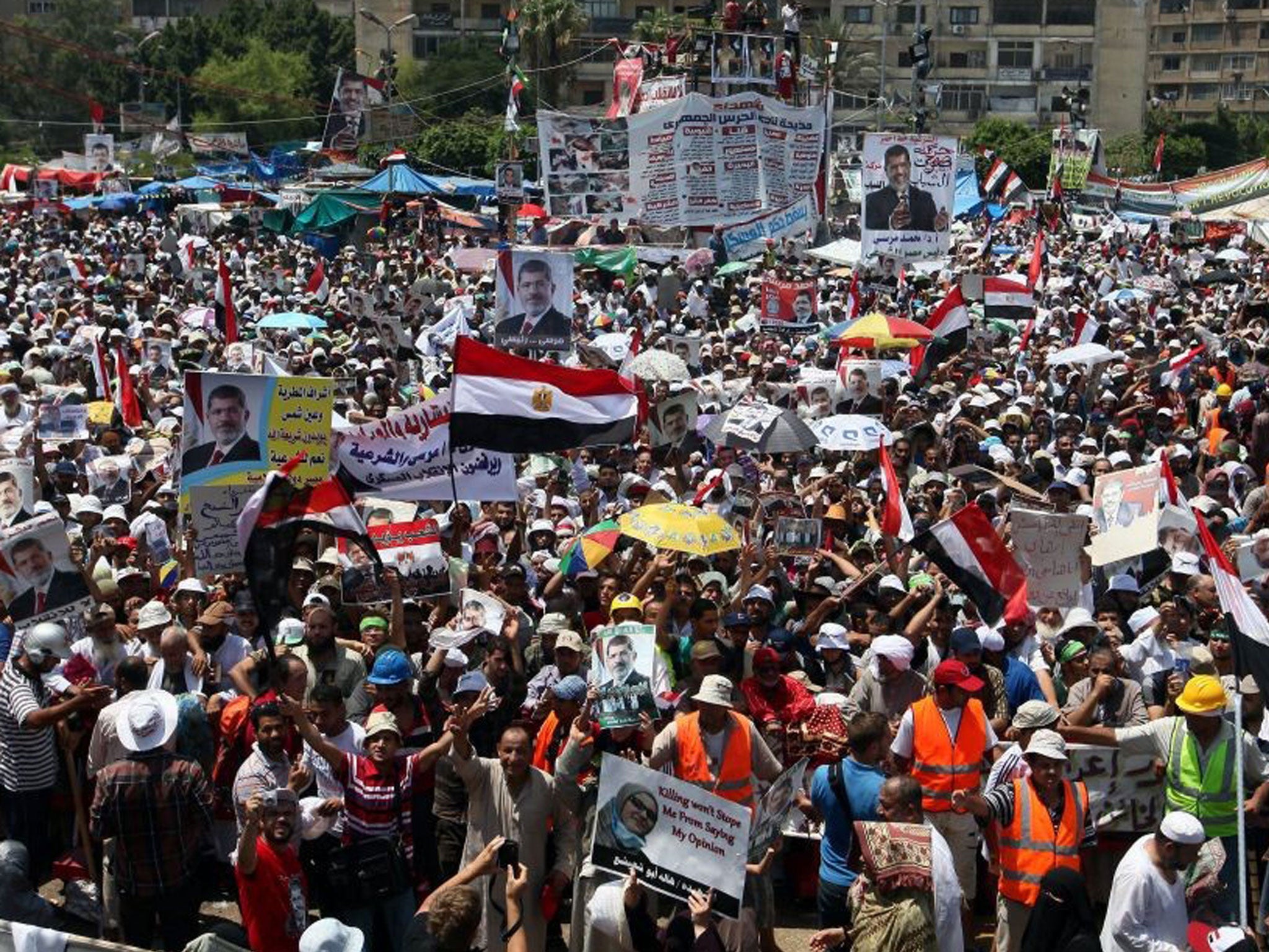 Protesters gather in a show of support for President Morsi in one of two Muslim Brotherhood camps