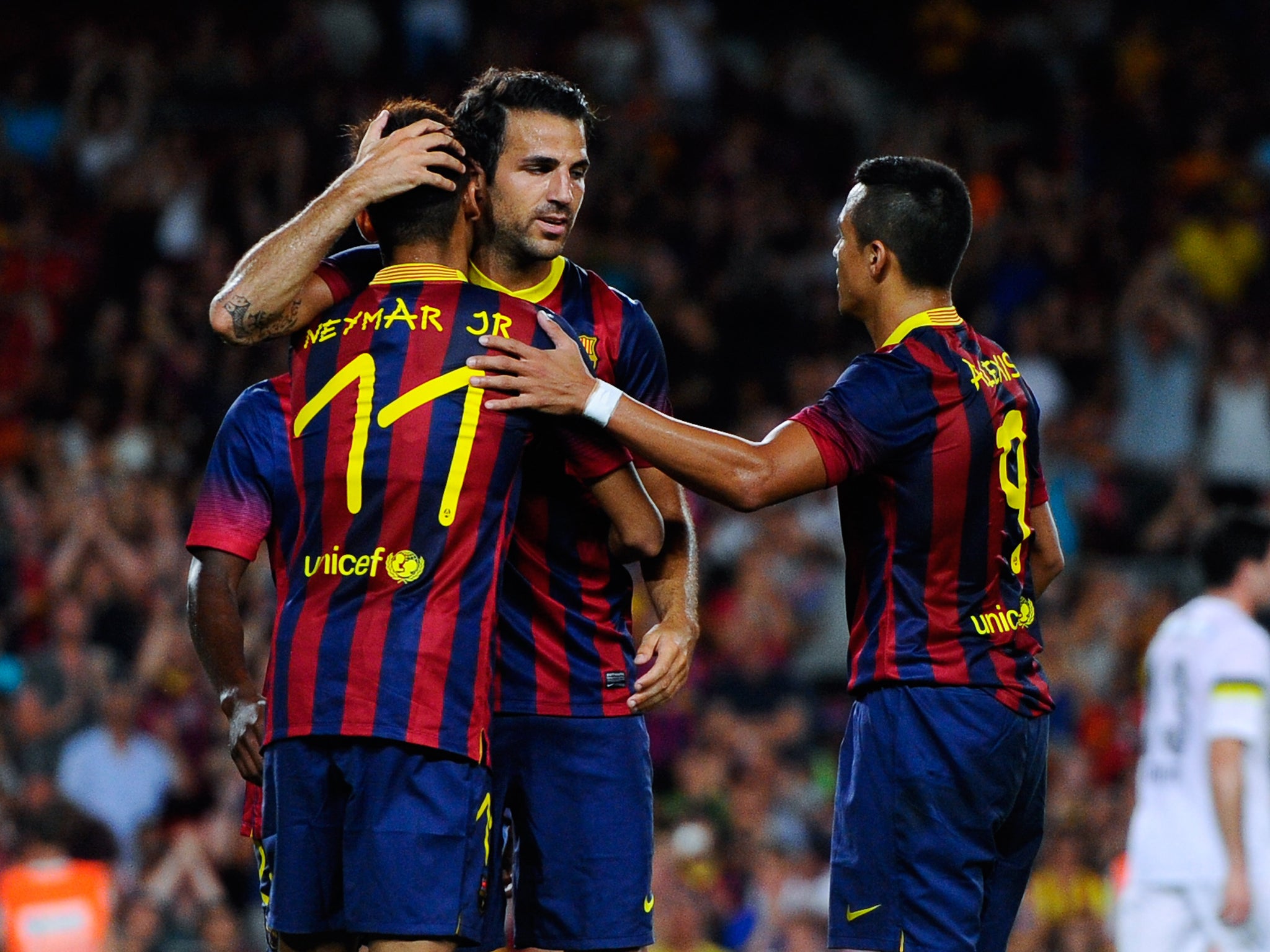 Cesc Fabregas celebrates his double against Santos in a pre-season friendly