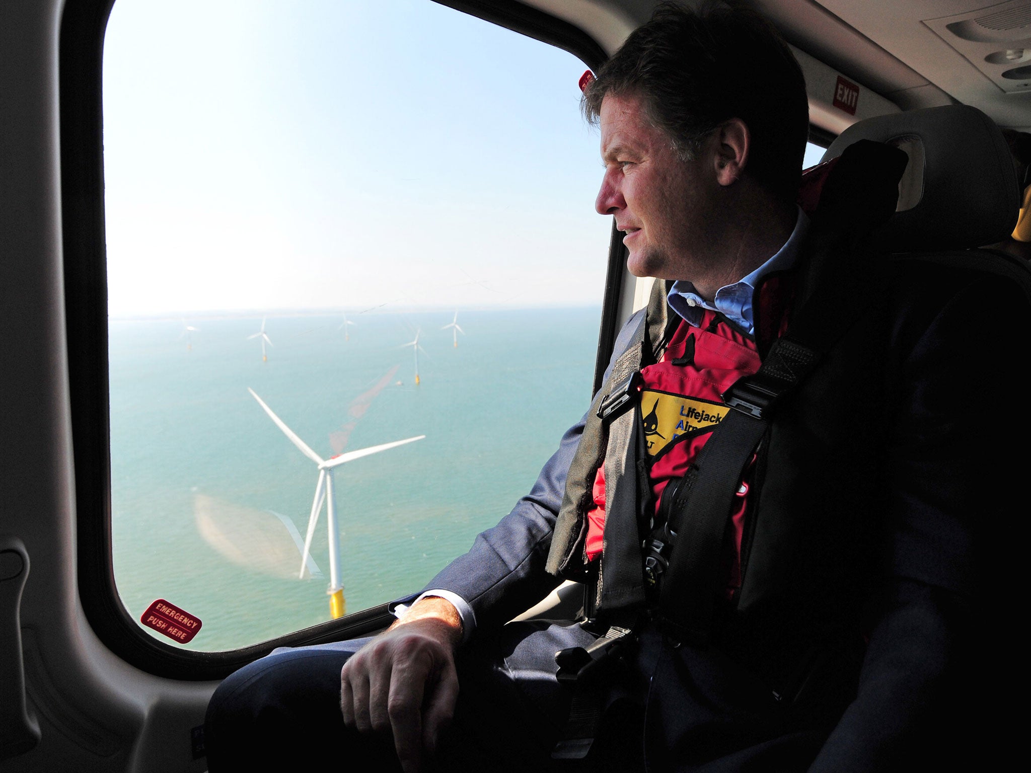 Nick Clegg looks out of a helicopter window over the new Centrica Energy Lincs offshore wind farm