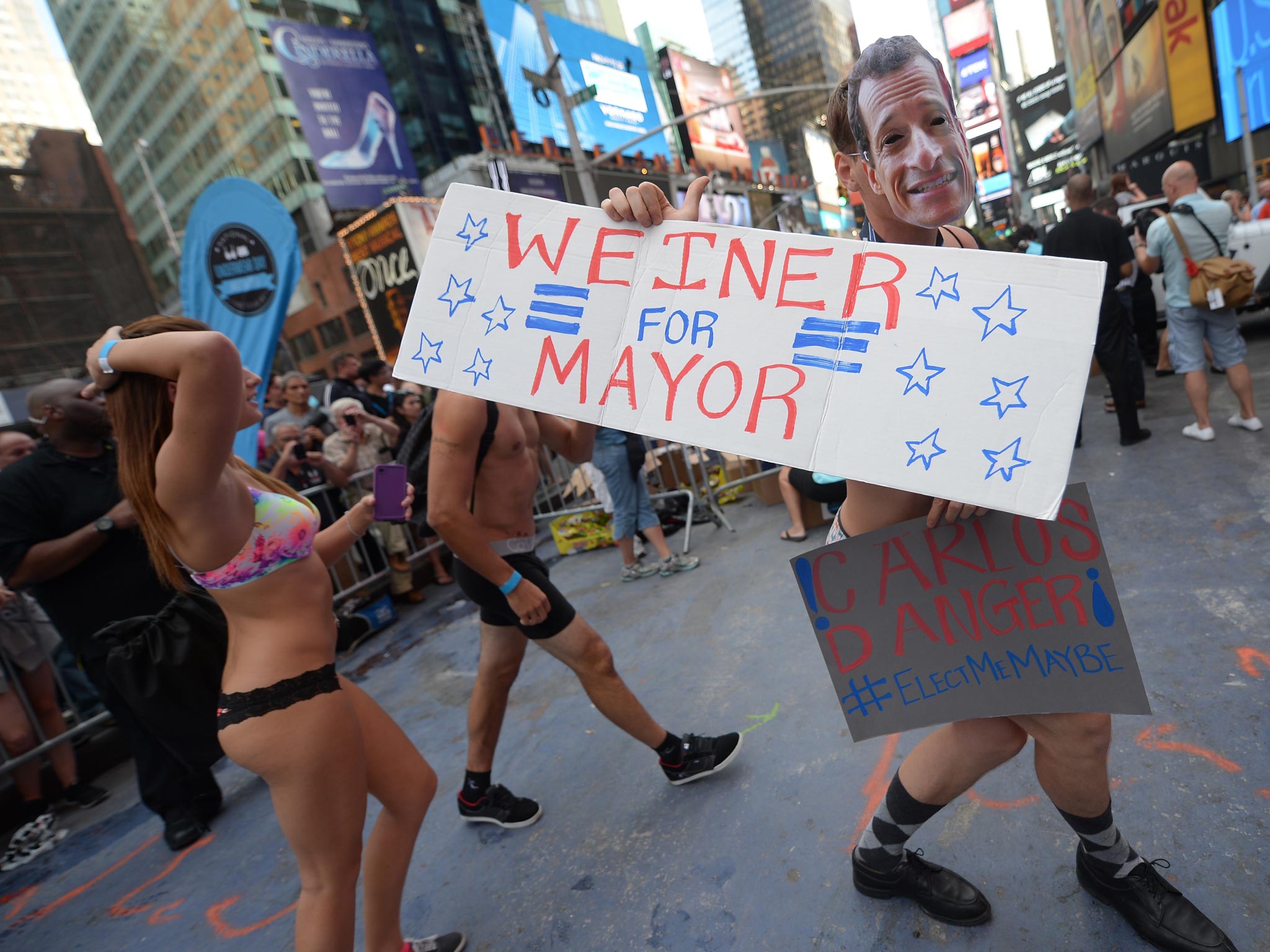 A participant masked as the sex-related-scandal mayoral candidate Anthony Weiner in Times Square when his sexting habits first broke