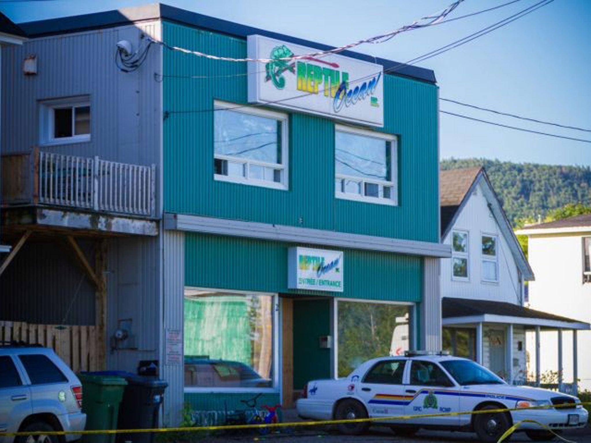 A Royal Canadian Mounted Police cruiser sits outside the Reptile Ocean exotic pet store in Campbellton, New Brunswick