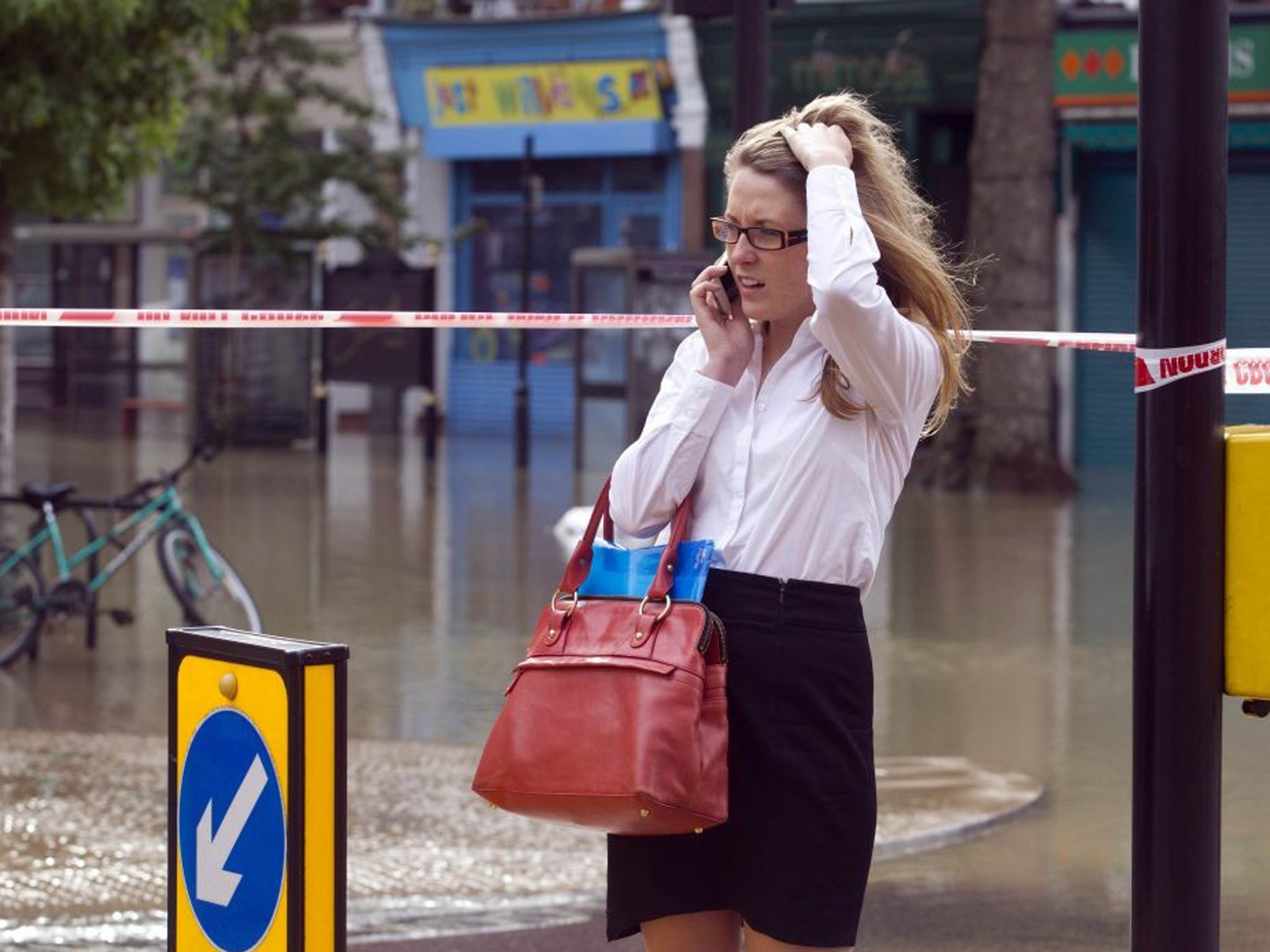 A woman on her phone at Half Moon Lane in Herne Hill