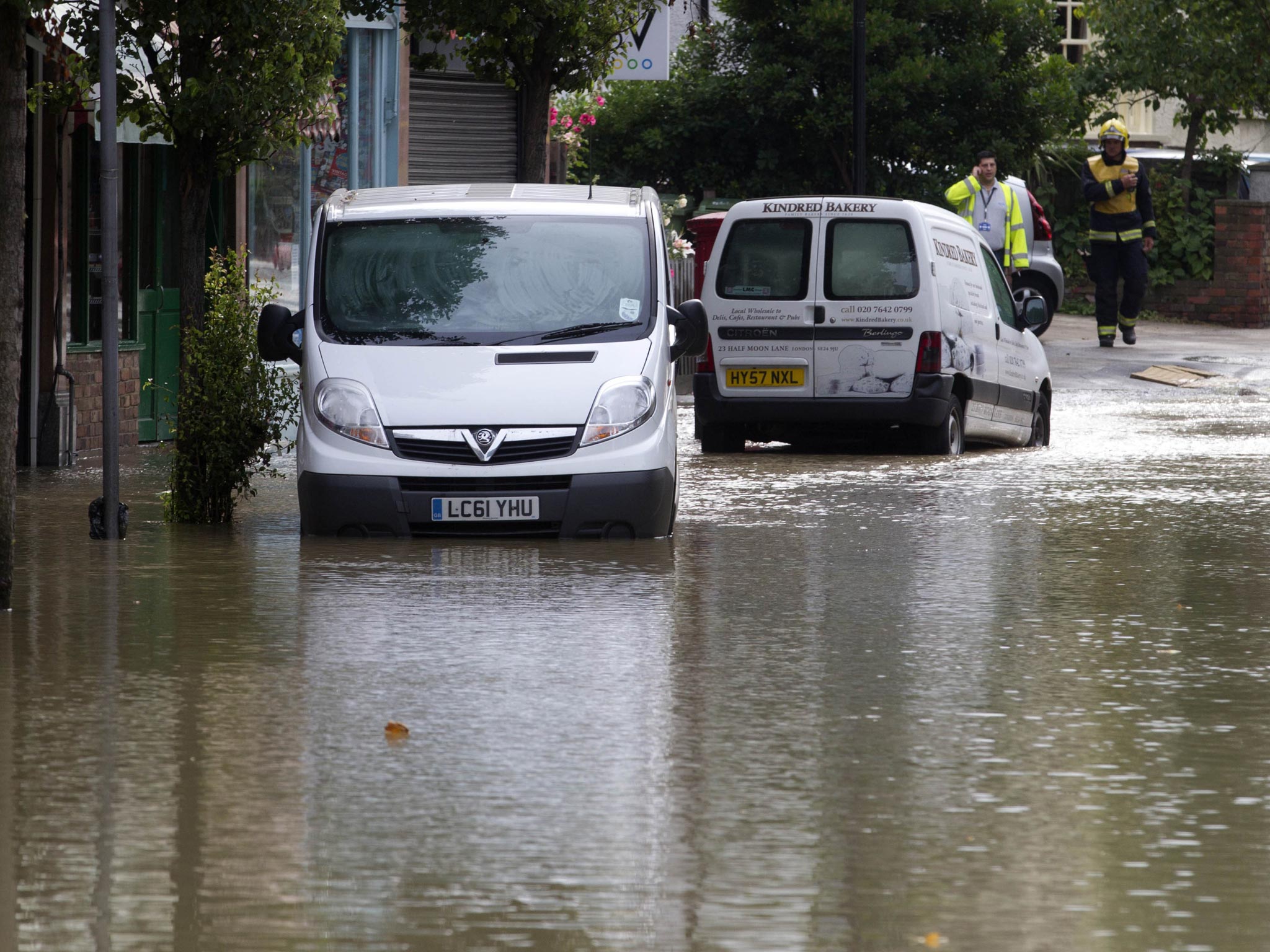 London Fire Brigade in attendance at Half Moon Lane in Herne Hill, London as a burst water main has resulted in severe flooding with water up to a meter deep in some places