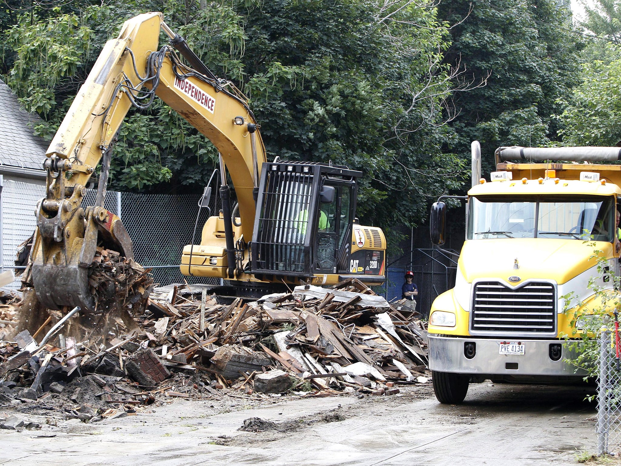 The house of horrors was demolished as spectators cheered from the street