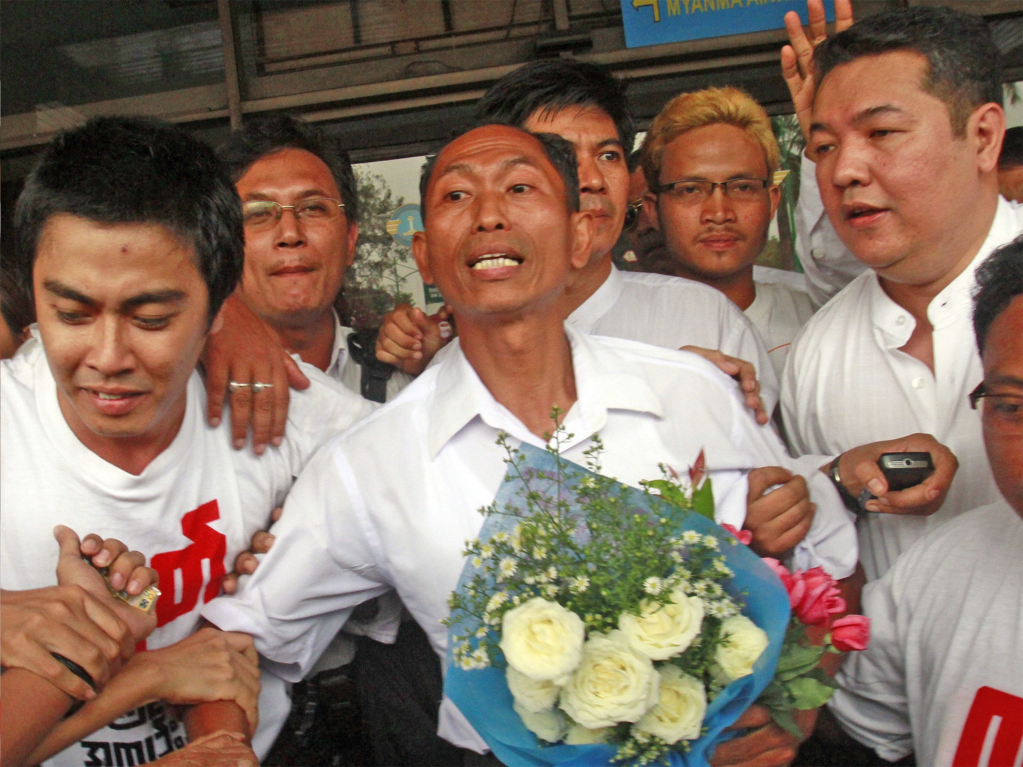 Ko Ko Gyi, a former political prisoner, celebrates with supporters after being released under a Burmese government amnesty last year