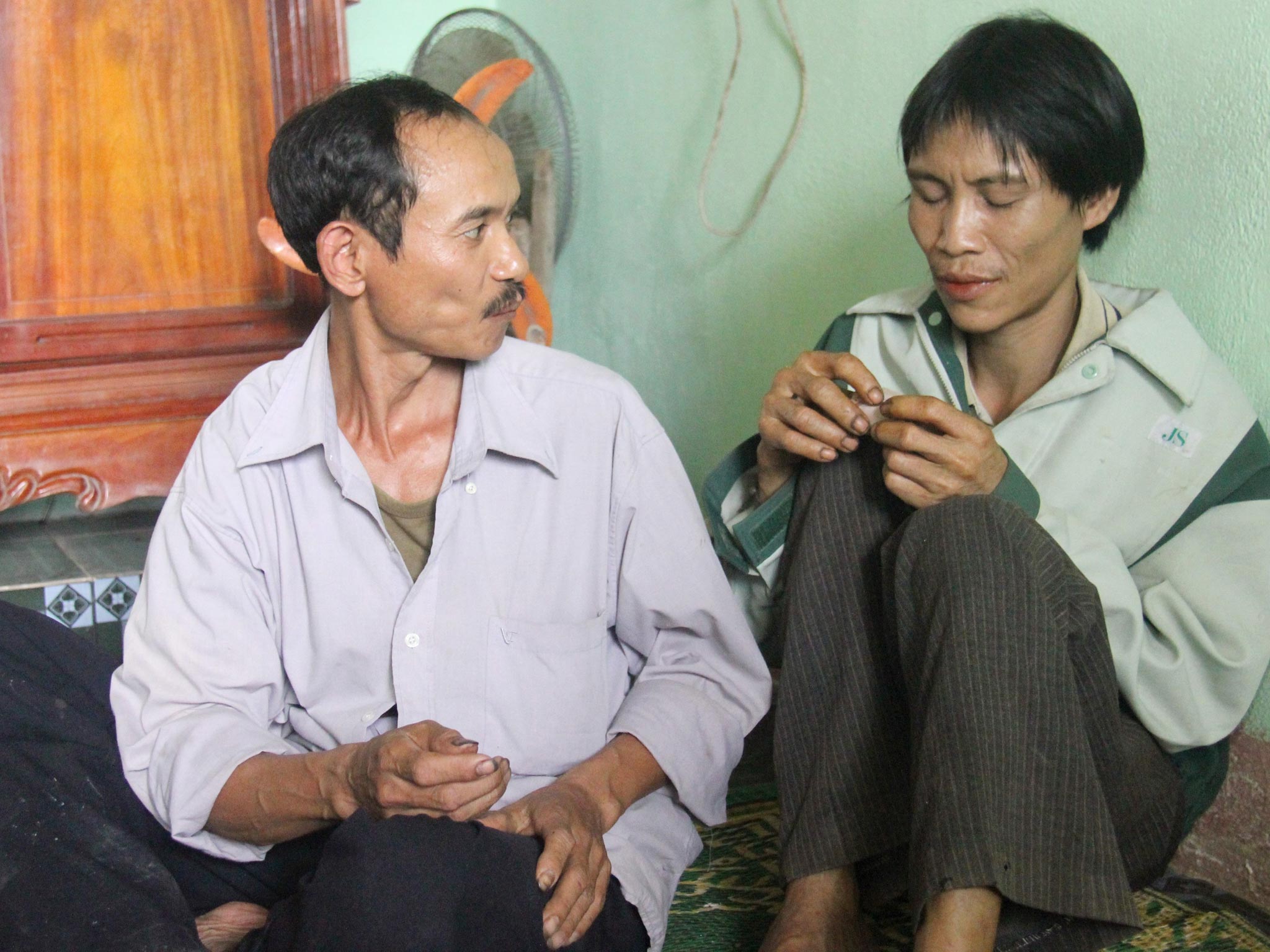Forty-one-year-old Ho Van Lang (right) in Quang Ngai, Vietnam. An 82-year-old man and his 41-year-old son were found living in a forest in central Vietnam after they went missing during the country's war with the United States, an official said