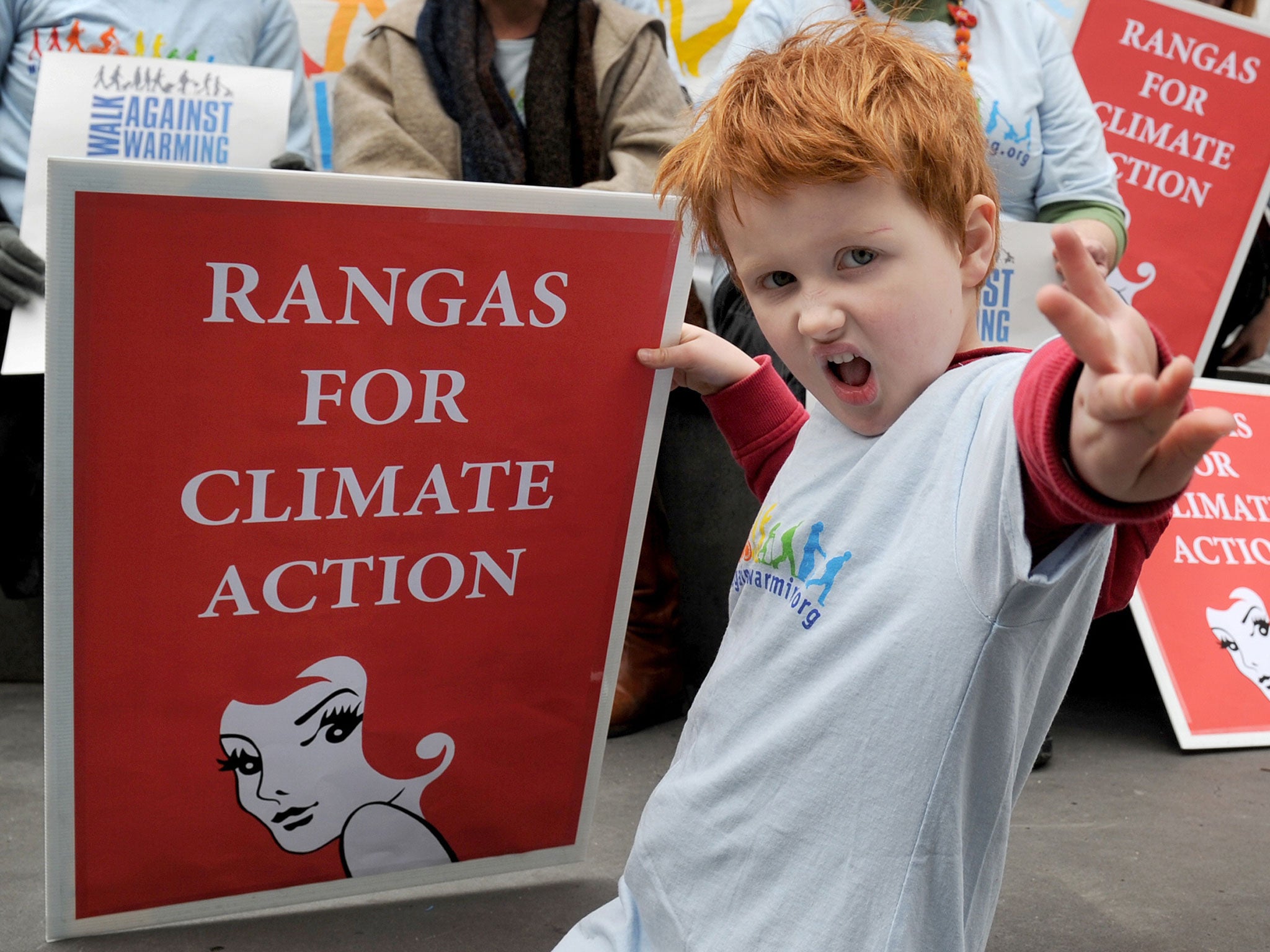 Five year-old Findlay Gledhill holds a banner as a group of redheads hits the streets of Melbourne protesting their view that there has been a lack of strong policies to reduce greenhouse pollution so far in the Federal election campaign, on August 4, 2010. "Ranga" is a slang word for redheads in Australia.