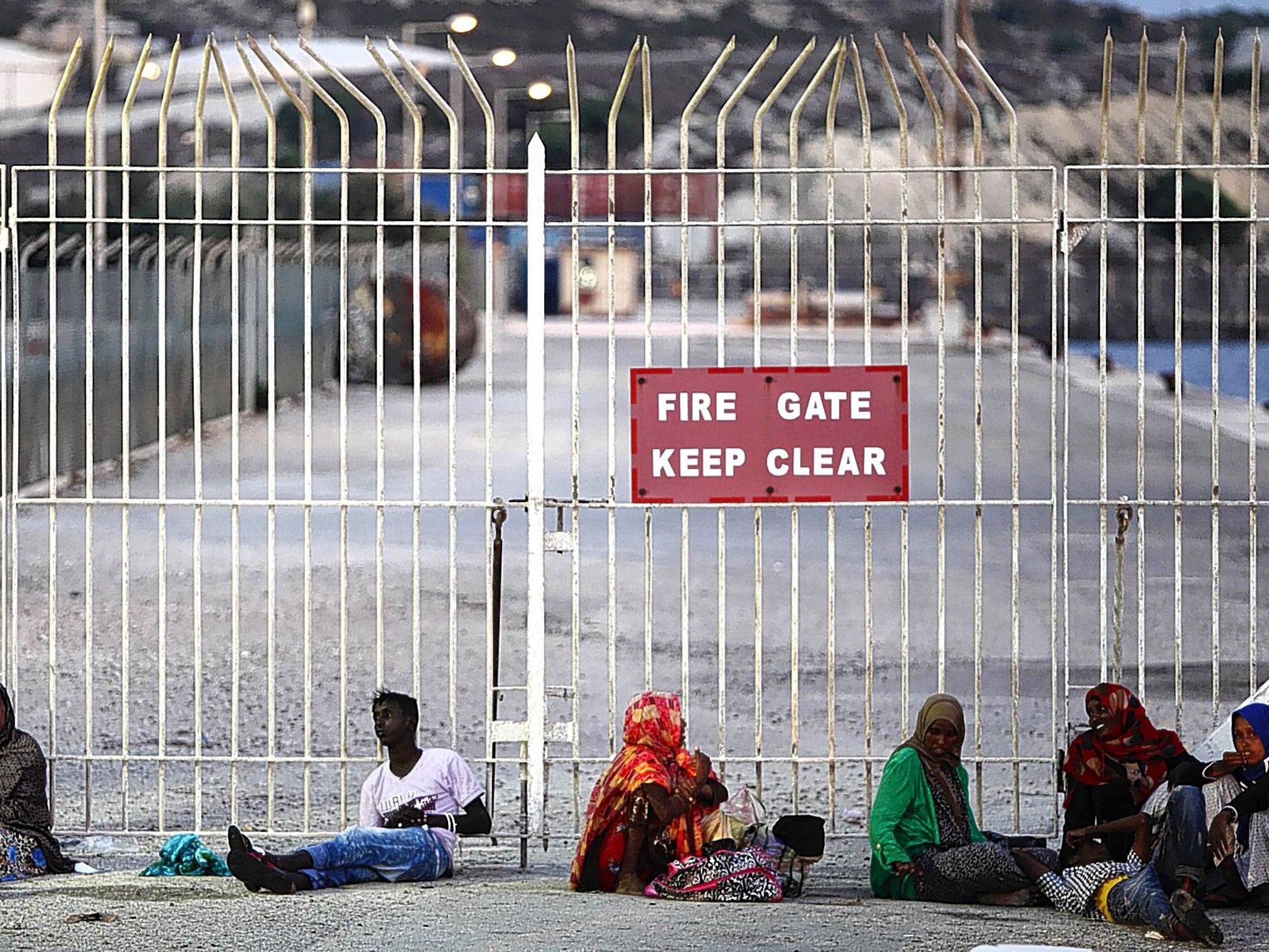 Recently arrived migrants near the village of Marsaxlokk in the south-east