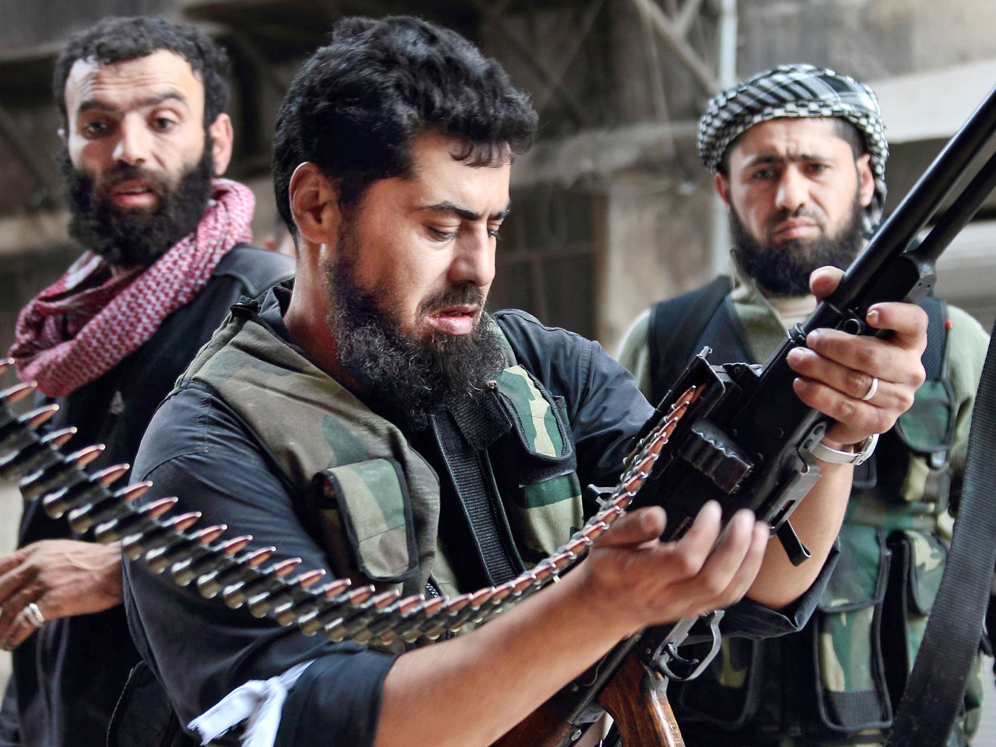 Rebel fighters in in the Sheikh Maqsoud district of Aleppo