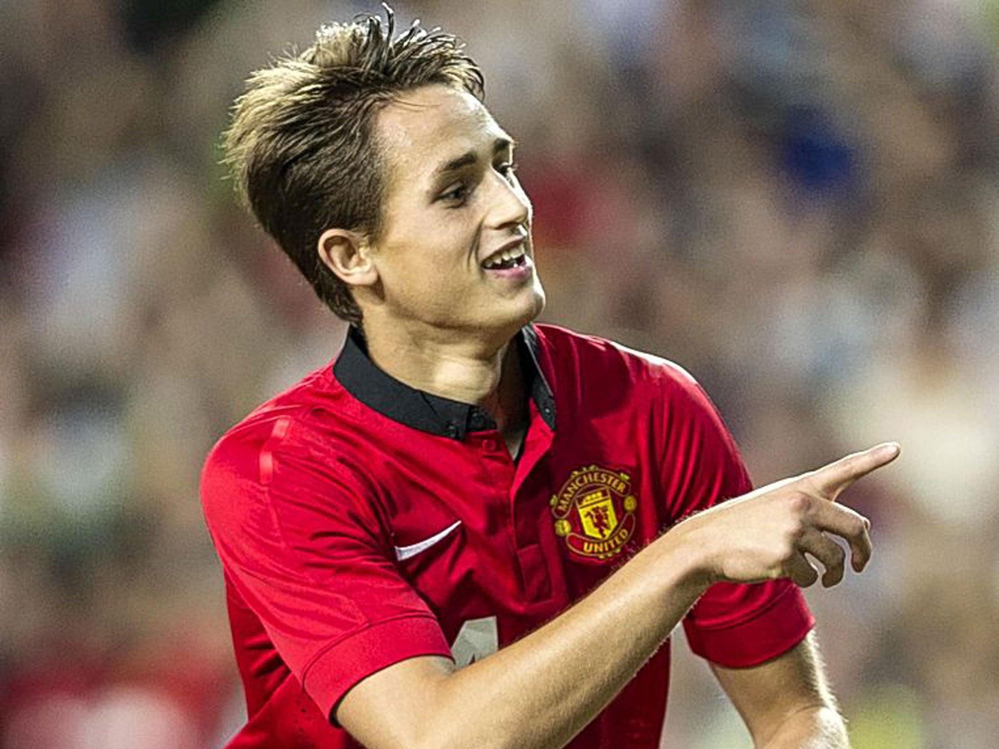 Adnan Januzaj celebrates scoring for Manchester United during their pre-season friendly against Kitchee FC