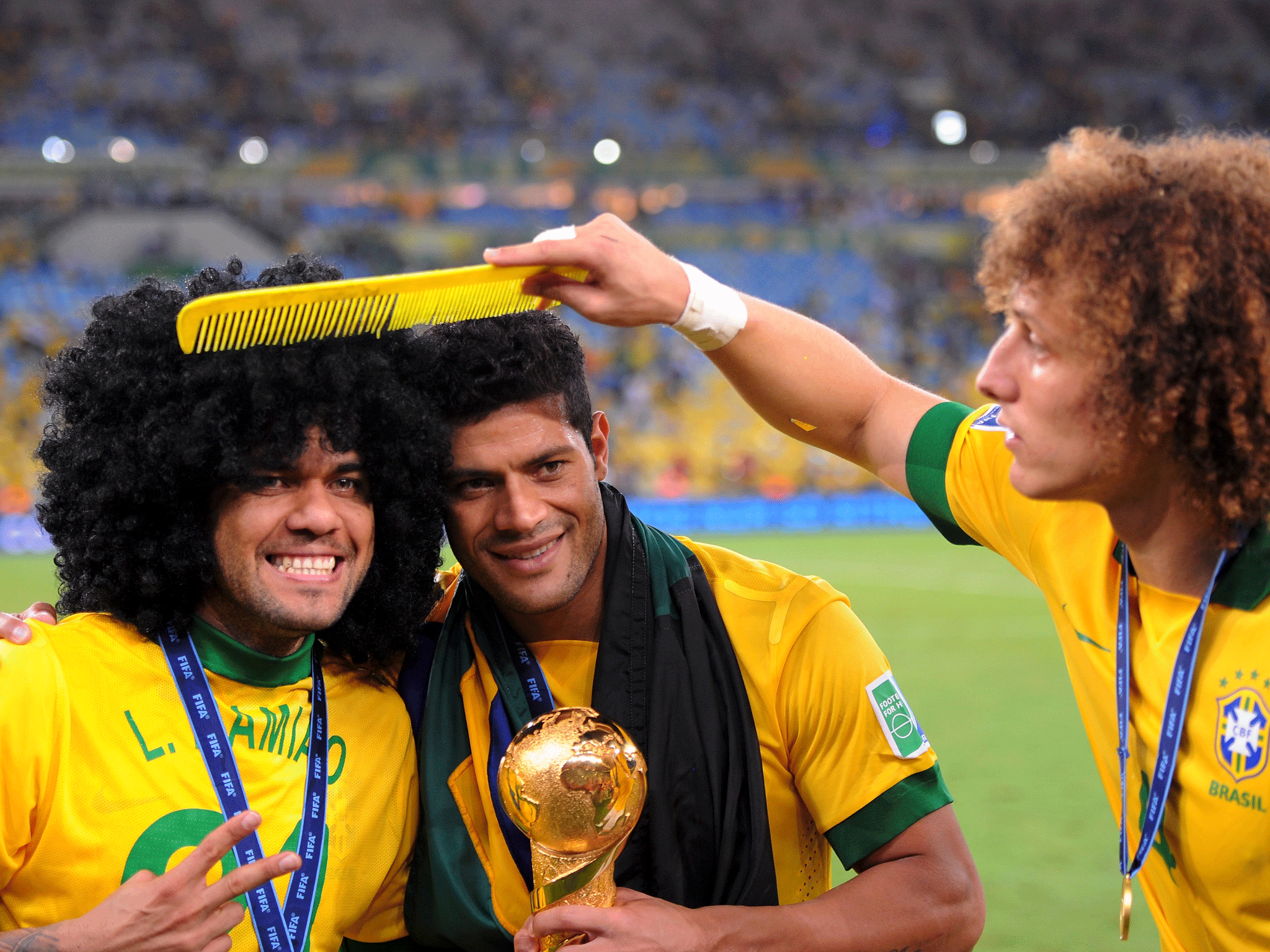 Dani Alves (l), Hulk (c) and David Luiz (r) celebrate Brazil's Confederations Cup victory