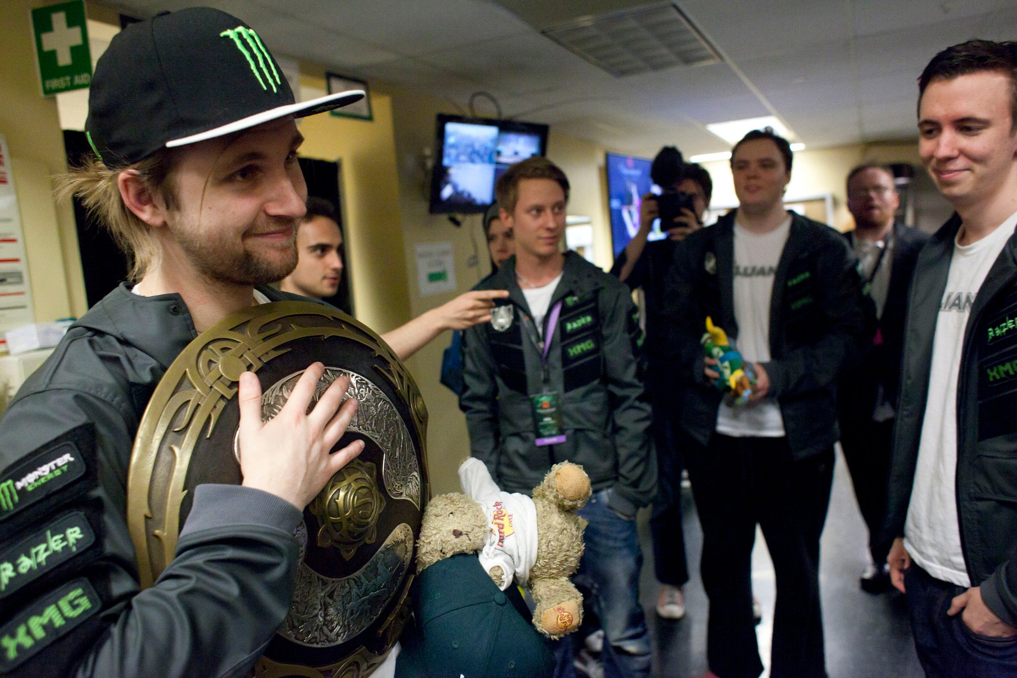 Competitor Jonathan Berg (L) of "The Alliance" holds the champion's shield backstage after his team won first place during "The International" Dota 2 video game competition in Seattle, REUTERS/David Ryde