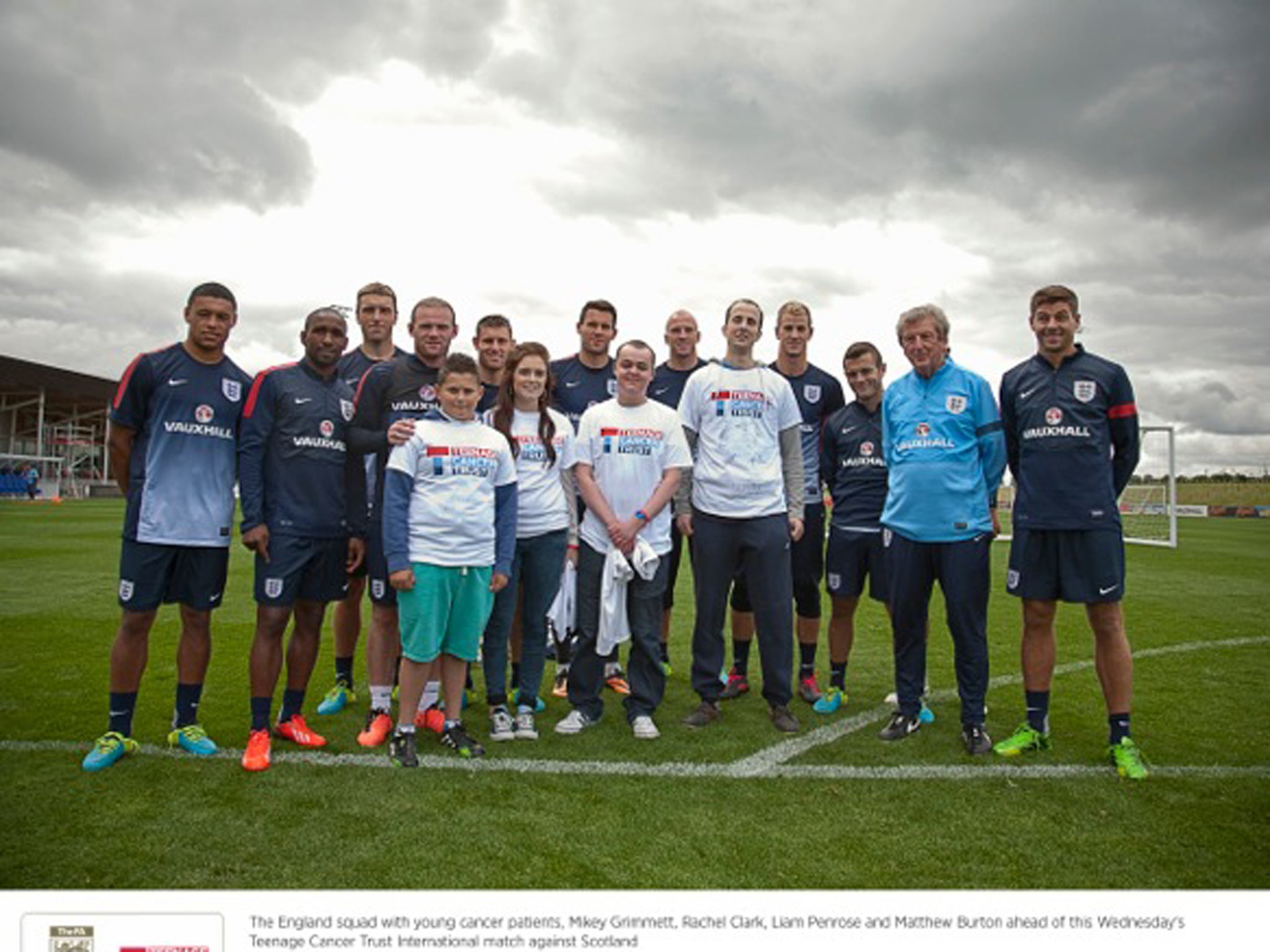 The England squad with young cancer patients Mikey Grimmett, Rachel Clark, Liam Penrose and Matthew Burton ahead of this Wednesday's Teenage Cance Trust International match against Scotland