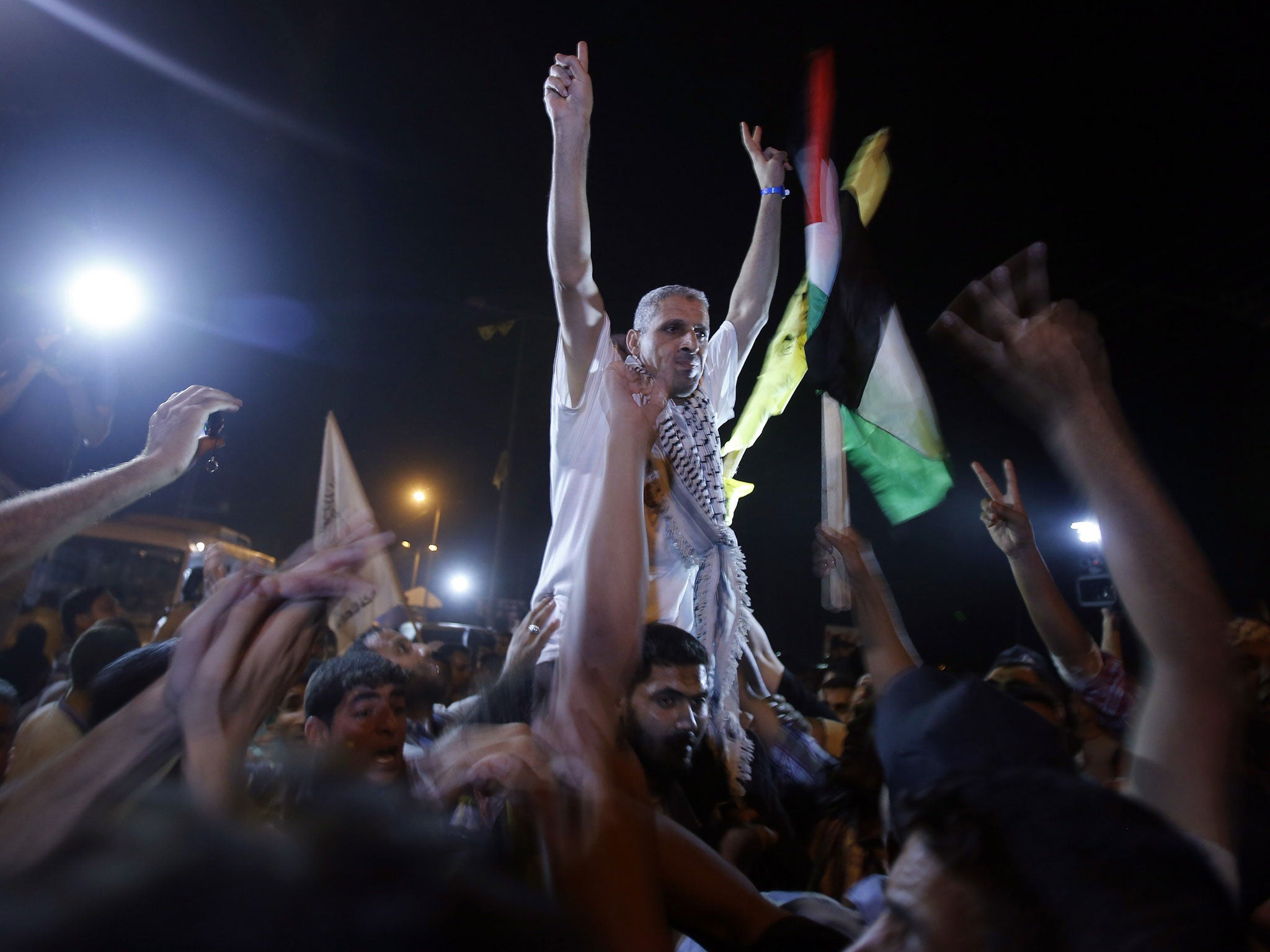 A freed Palestinian prisoner gestures upon his arrival near Erez crossing, between Israel and northern Gaza Strip
