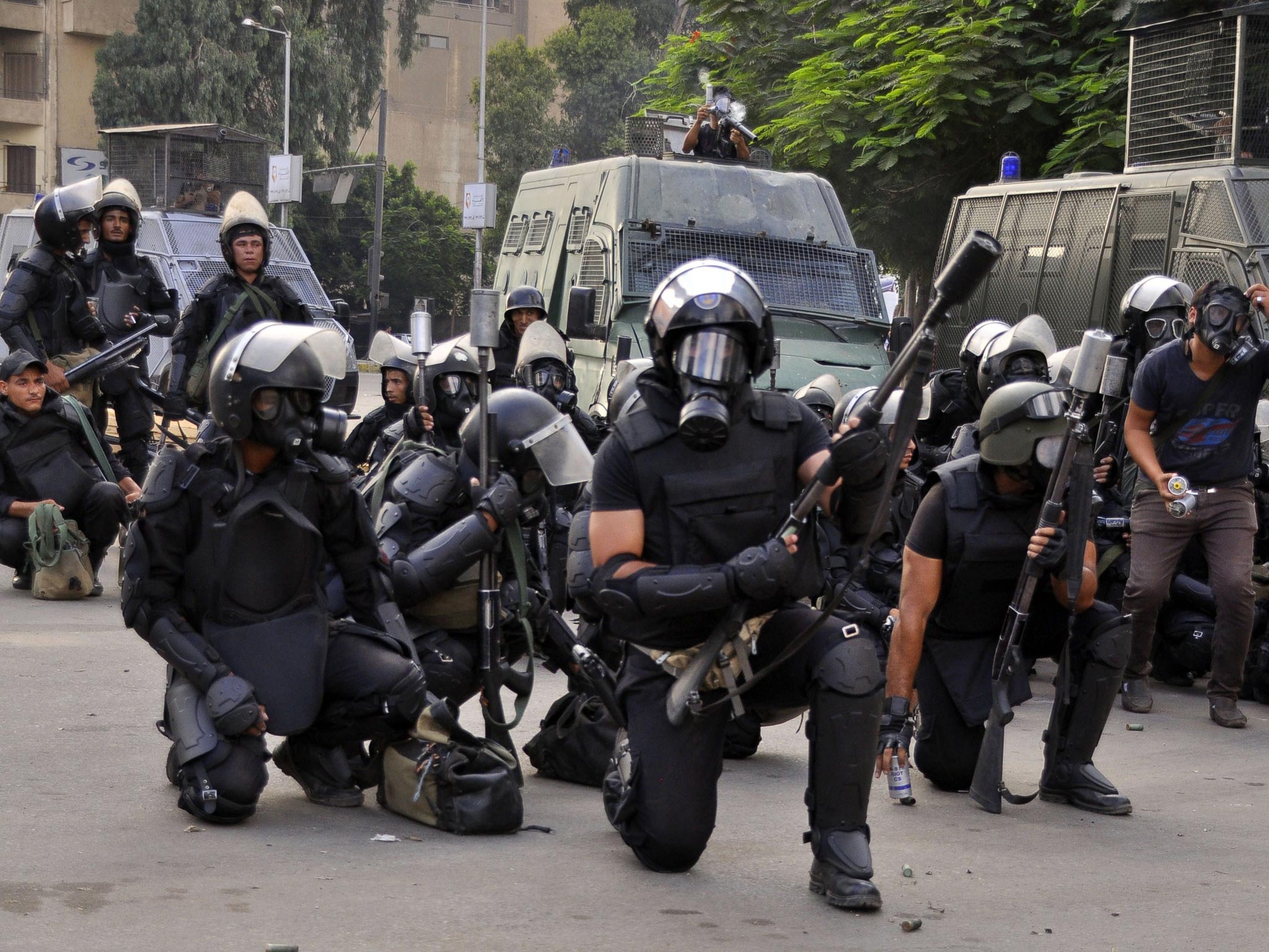 Riot police move in to disperse supporters of Egypt's deposed president Mohammed Morsi